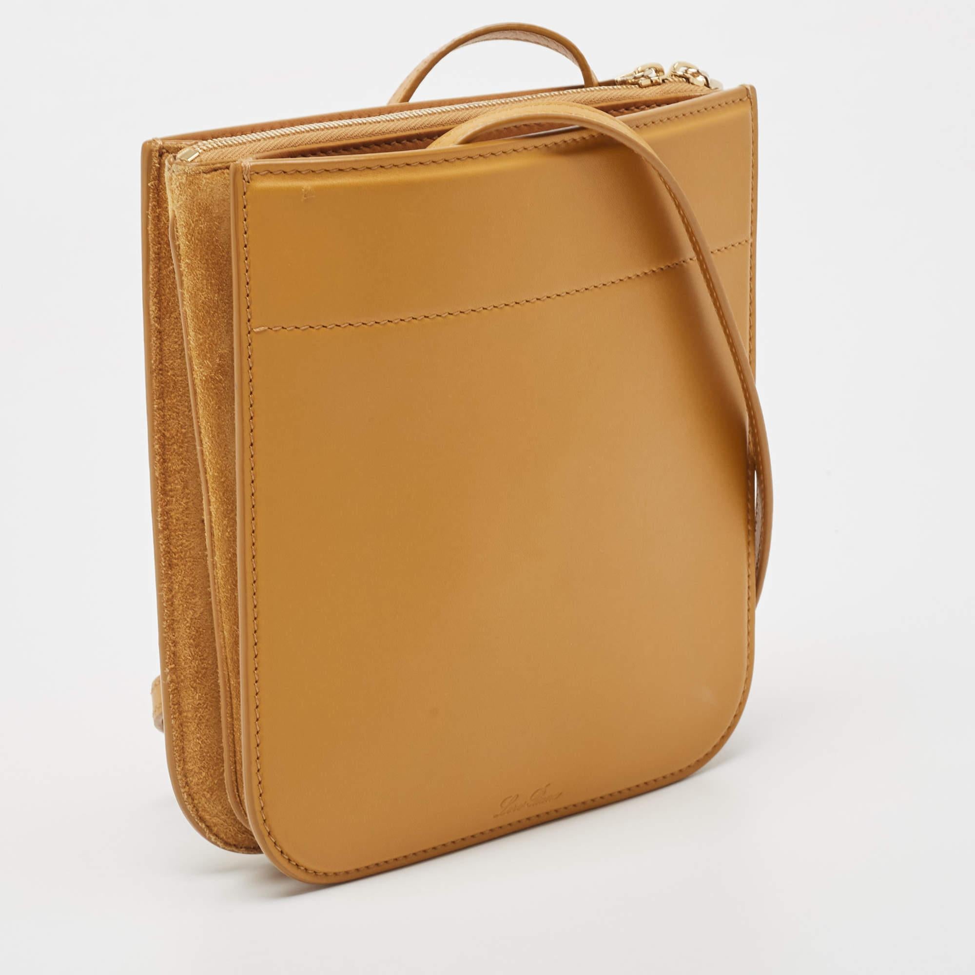 This shoulder handbag by Loro Piana is a practical choice perfect for carrying your daily needs. Presenting a leather & suede handbag which is an absolute mixture of style and utility. This My Way crossbody bag from Loro Piana features a long