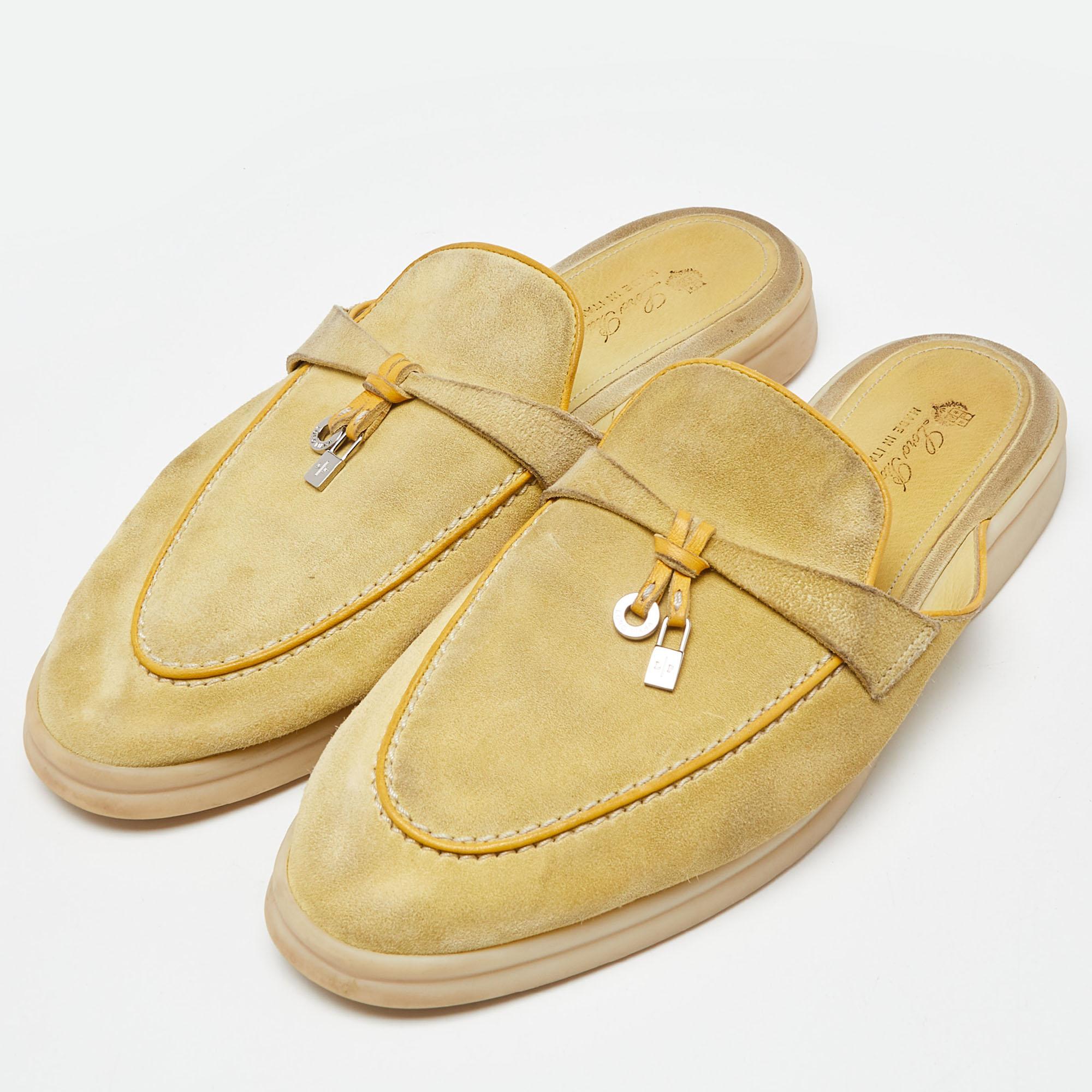 Crafted by Loro Piana, these Babouche Charms Walk Sandals embody understated elegance. Meticulously constructed from luxurious suede, they exude timeless charm. With delicate charms adorning the straps, they offer a touch of refinement to any