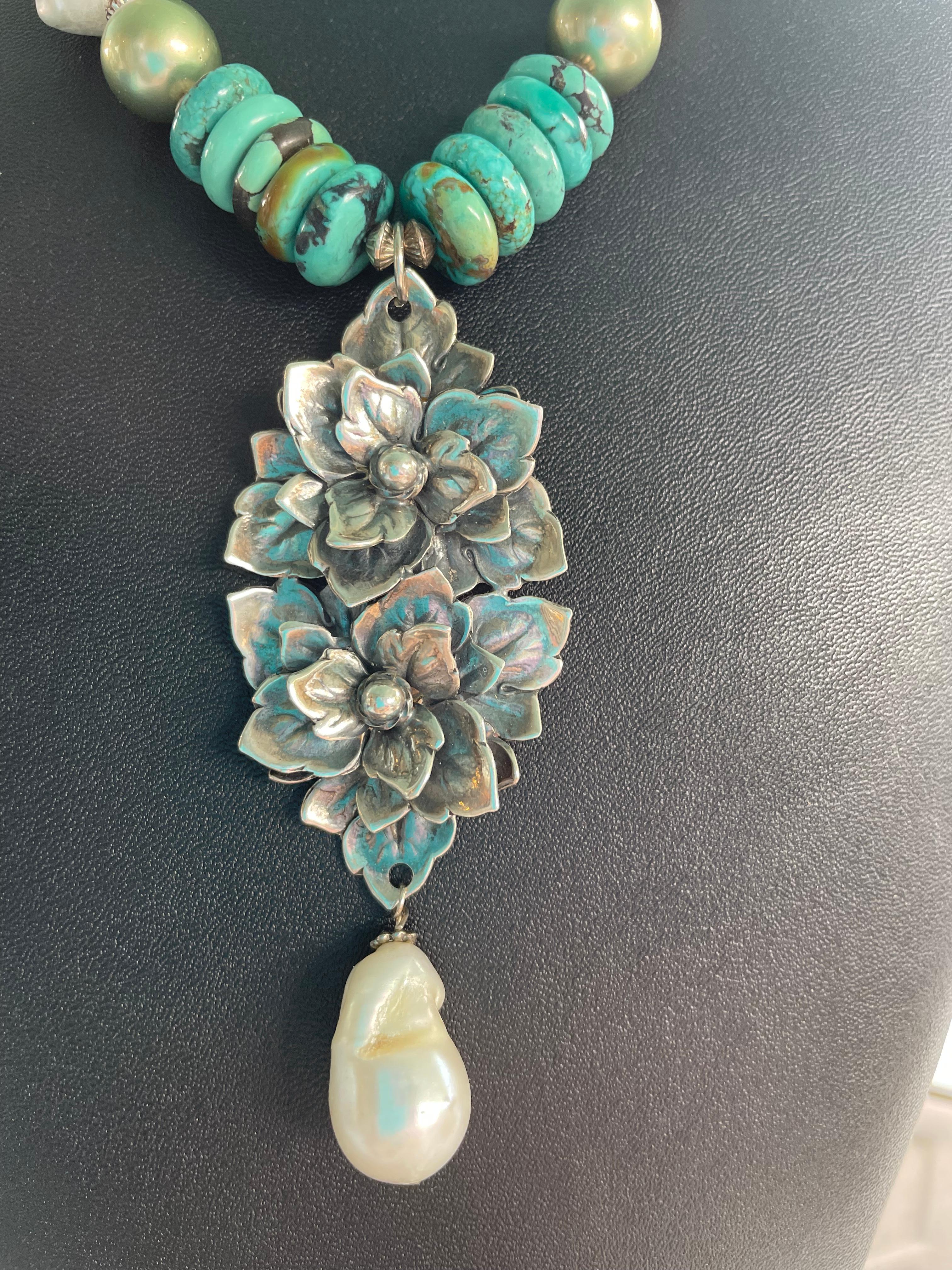 This one of a kind,handmade,necklace features a vintage Hobe sterling silver brooch as its’ centerpiece. It hangs from a strand of baroque pearls, Kingman turquoise discs, vintage sterling Mexican beads and vintage faceted sterling beads. Also has a
