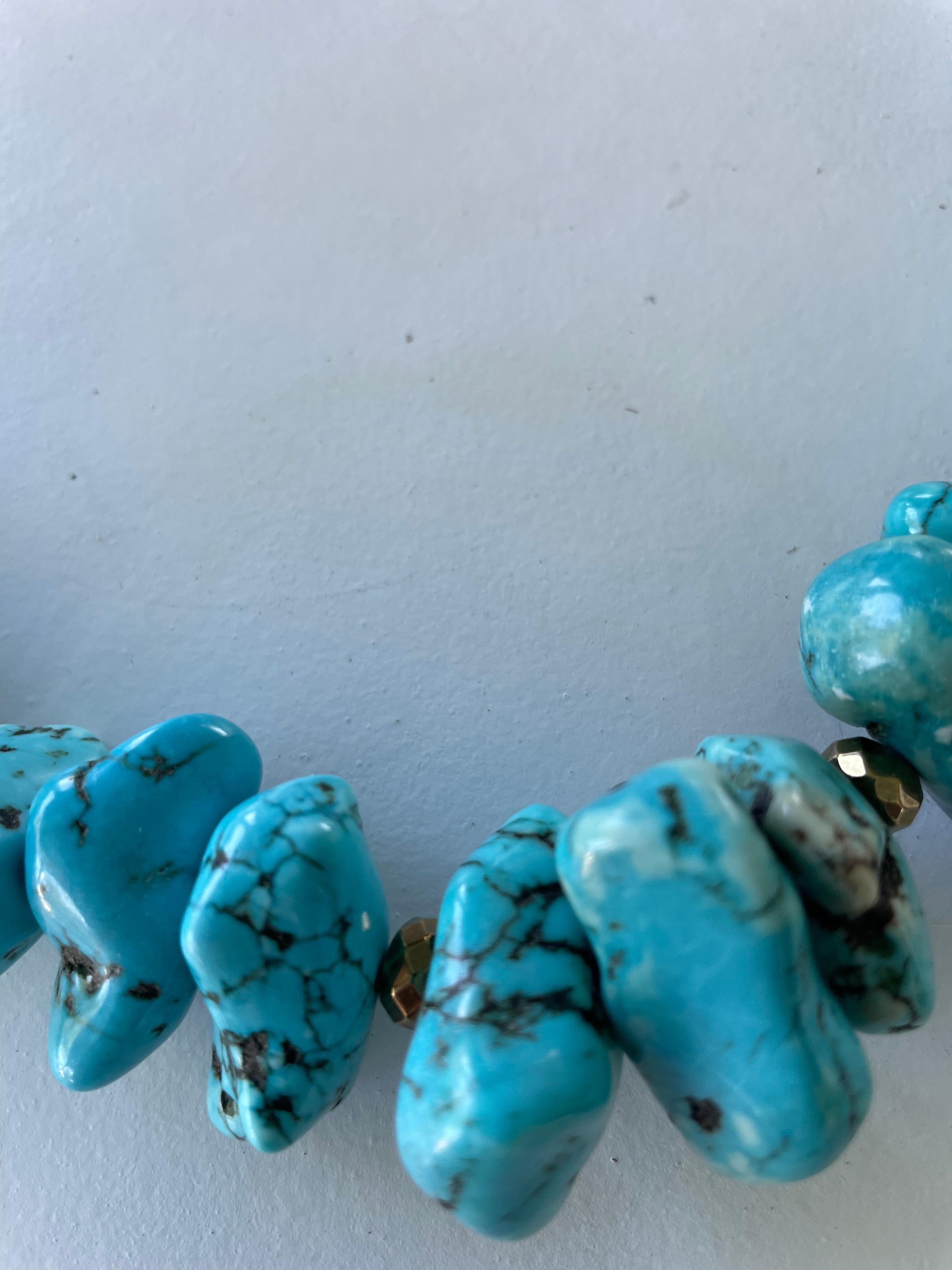 A one of a kind, handmade, statement turquoise necklace is offered from Lorraine’s Bijoux. All new turquoise pieces are combined with handmade Indonesian beads and the turquoise chunks are from China. The enameled beads are Indonesian and the