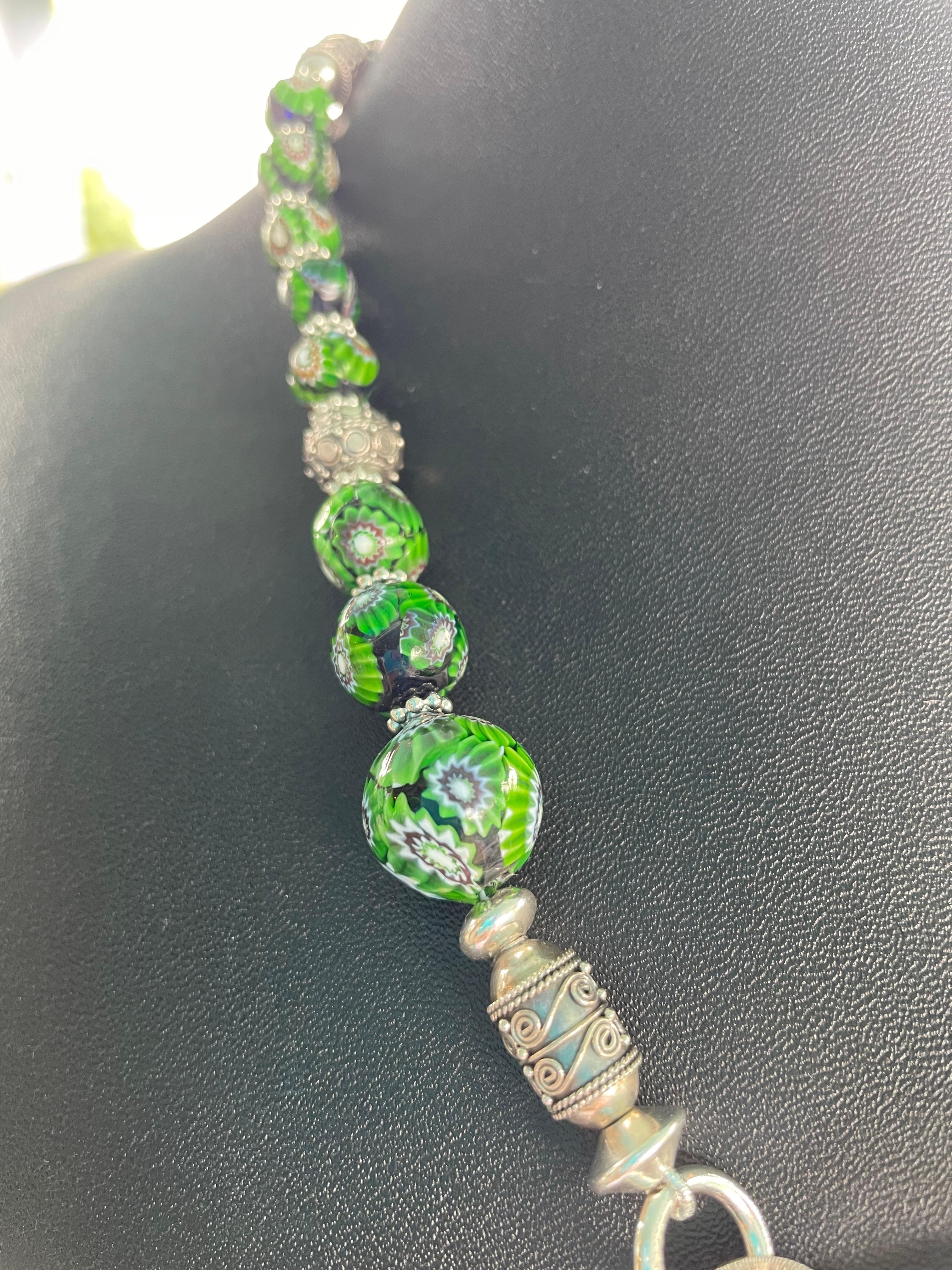Offering a Vintage Art Deco sterling silver brooch, with a vintage SS and marcasite pin. This is of a one of a kind handmade, statement necklace.,with vintage green Venetian beads and sterling silver beads. This piece is handmade . 


