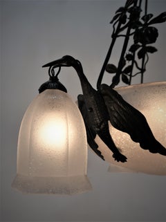 Lorrian/Daum, Kronleuchter aus Kunstglas und schmiedeeisernem Vogel