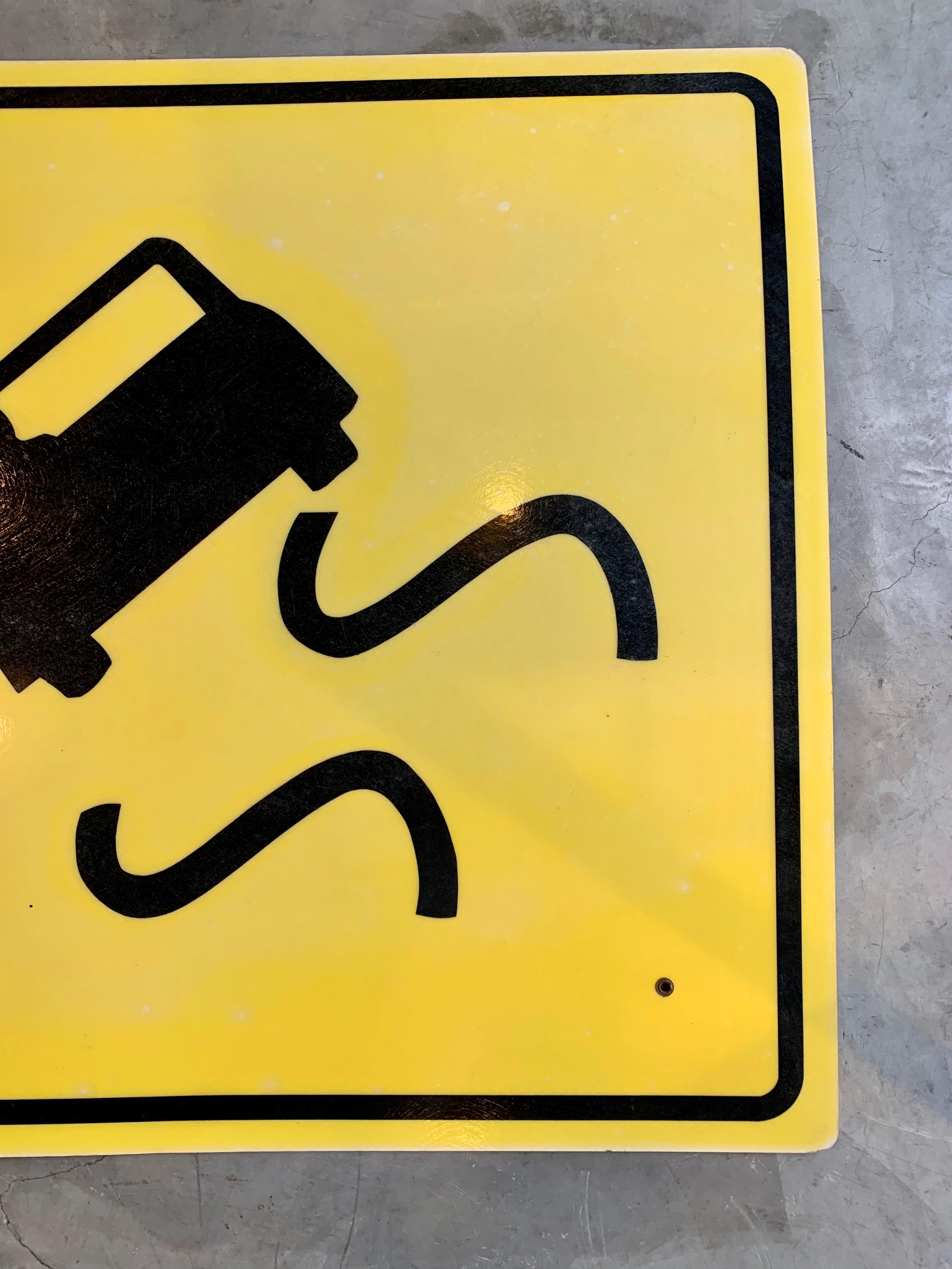 yellow sign with car and squiggly lines meaning