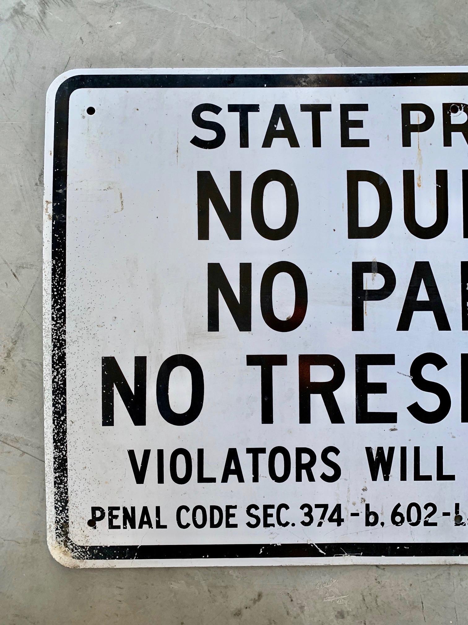 Vintage California sign from 1984. Reads 'STATE PROPERTY - NO DUMPING, NO PARKING, NO TRESPASSING - VIOLATORS WILL BE PROSECUTED.' Dated on the back. Good vintage condition.