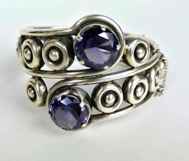 This is an excellent Vintage Los Ballesteros Sterling Silver Hinged Bracelet with  2 Large Faceted Amethyst set into the front.   This will fit up to a 7 inch wrist. Hidden clasp and safety chain. Excellent condition. Hallmarked inside bracelet