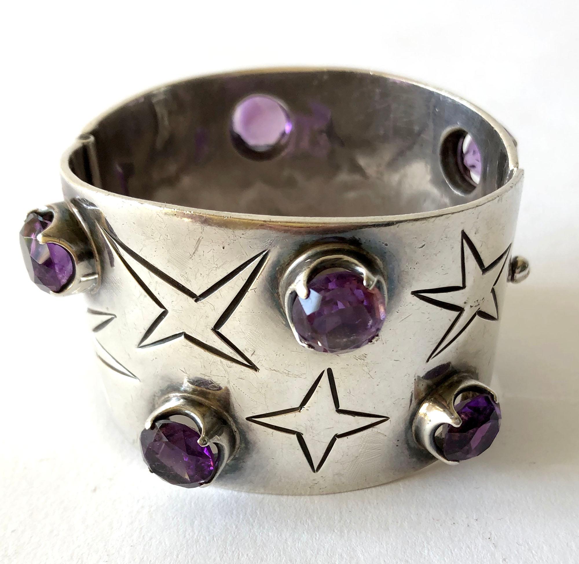 Sterling silver and amethyst hinged cuff bracelet created by Los Ballesteros of Taxco, Mexico.  Bracelet measures 1 3/4