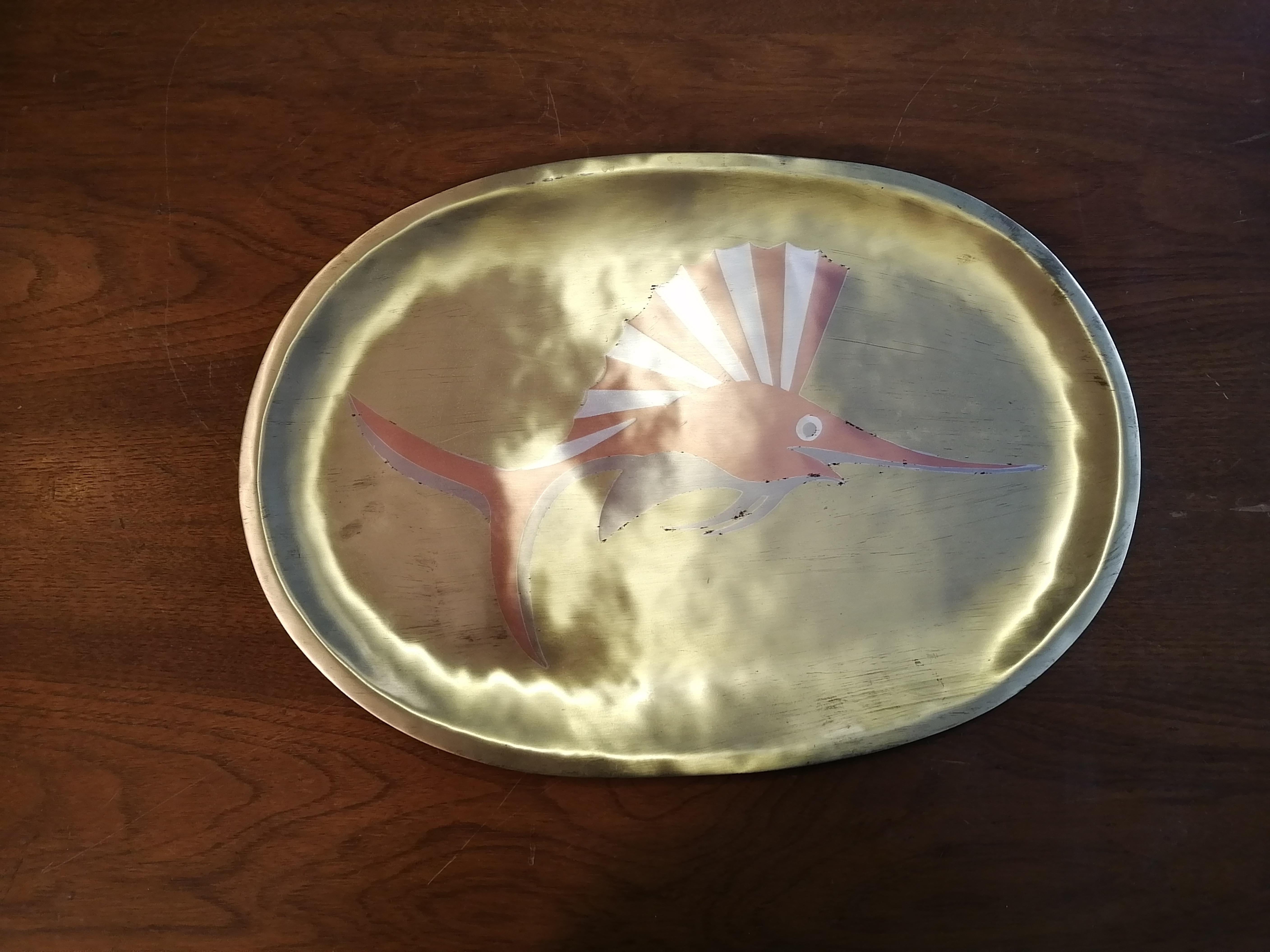 A beautiful Mexican Mid-Century Modern tray made in Metales Casados tecnique by Los Castillo. Taxco, México. The piece features a swordfish. Sealed on back and numbered 257.