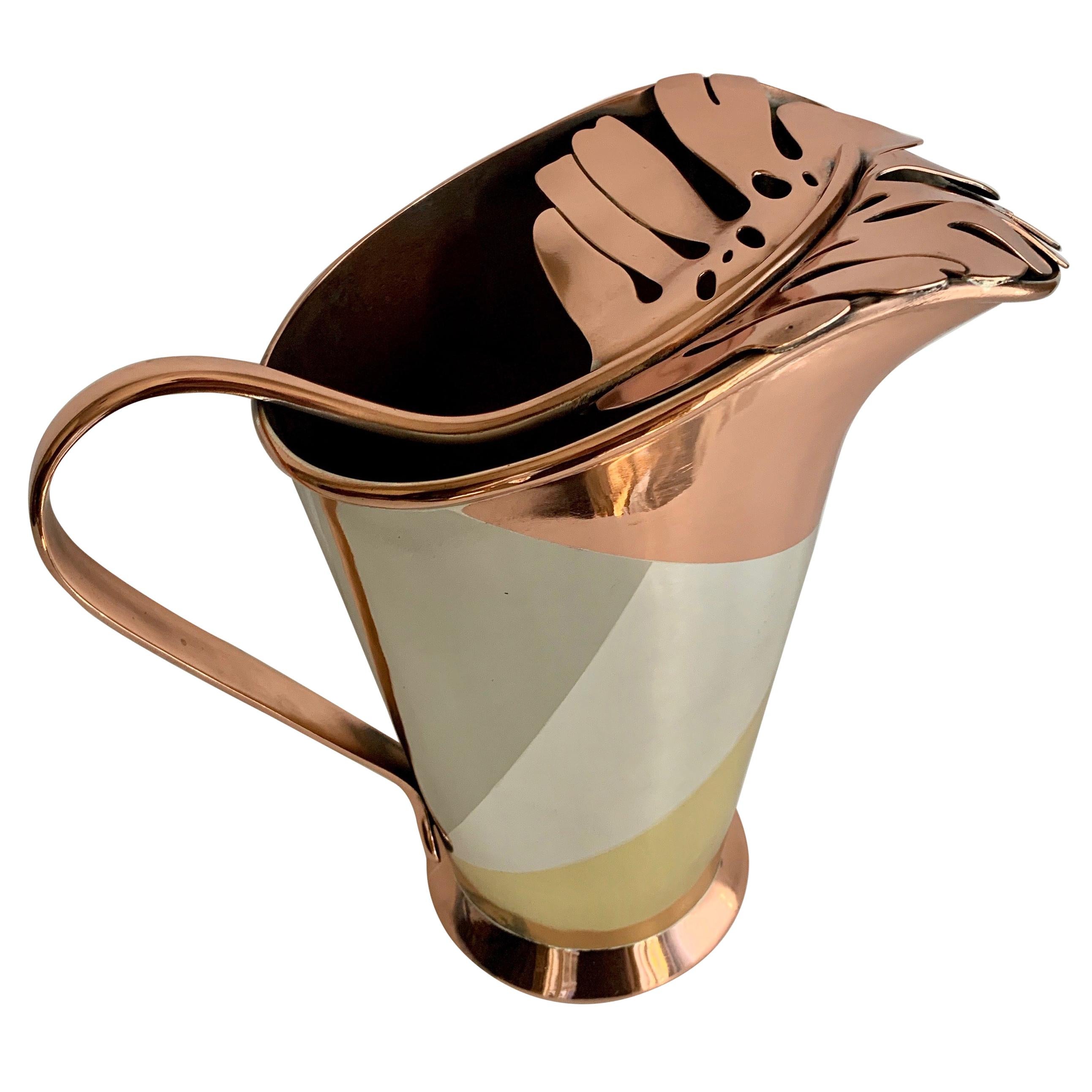 Multiple metal philodendron leaf handle pitcher by Mexican Designer Los Castillo - the pitcher is made of four metals that appear to be, Copper, Silver, Brass and Nickel. The Pitcher is a rare and handsome piece, perfect for drinks such as Sangria