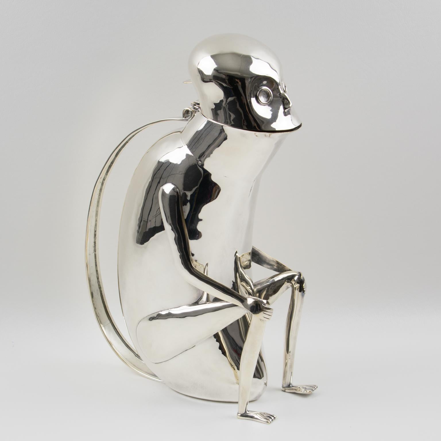 A fun whimsical silver plate metal lidded pitcher designed by Los Castillo, Mexico. Featuring a sitting monkey (sort of) in a very 