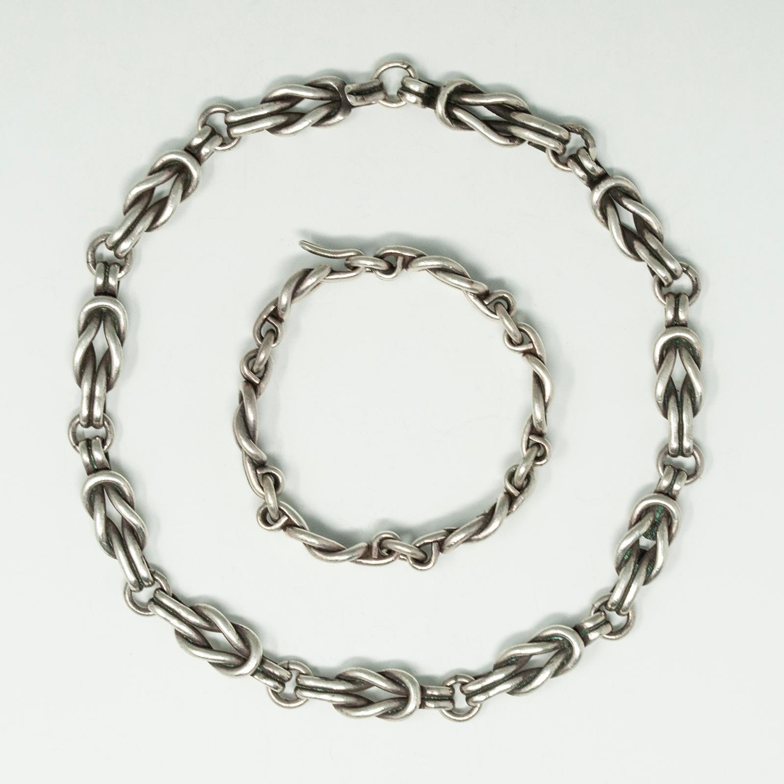Los Castillo sterling silver chain link necklace and bracelet set. Has Taxco #742 Los Castillo markings. Hook and loop closure. Chain link and square knot design. All fixtures are in working order and secure. 

Antonio Castillo and his three