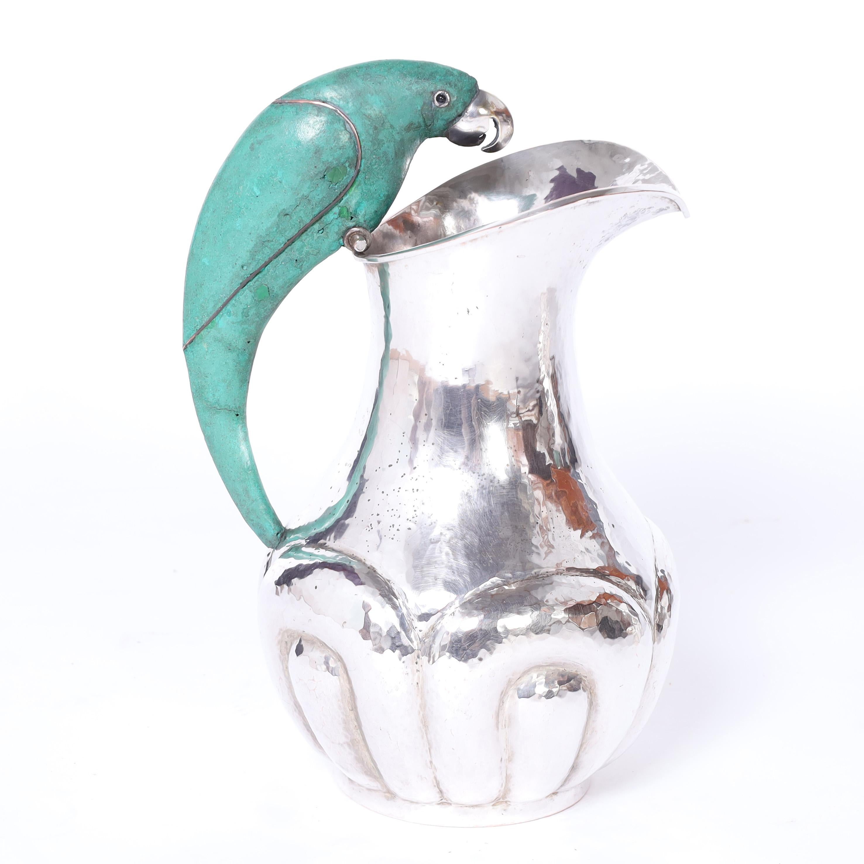 Mexican Los Castillo Style Near Pair of Mid Century Silver Plate Pitchers with Parrots For Sale