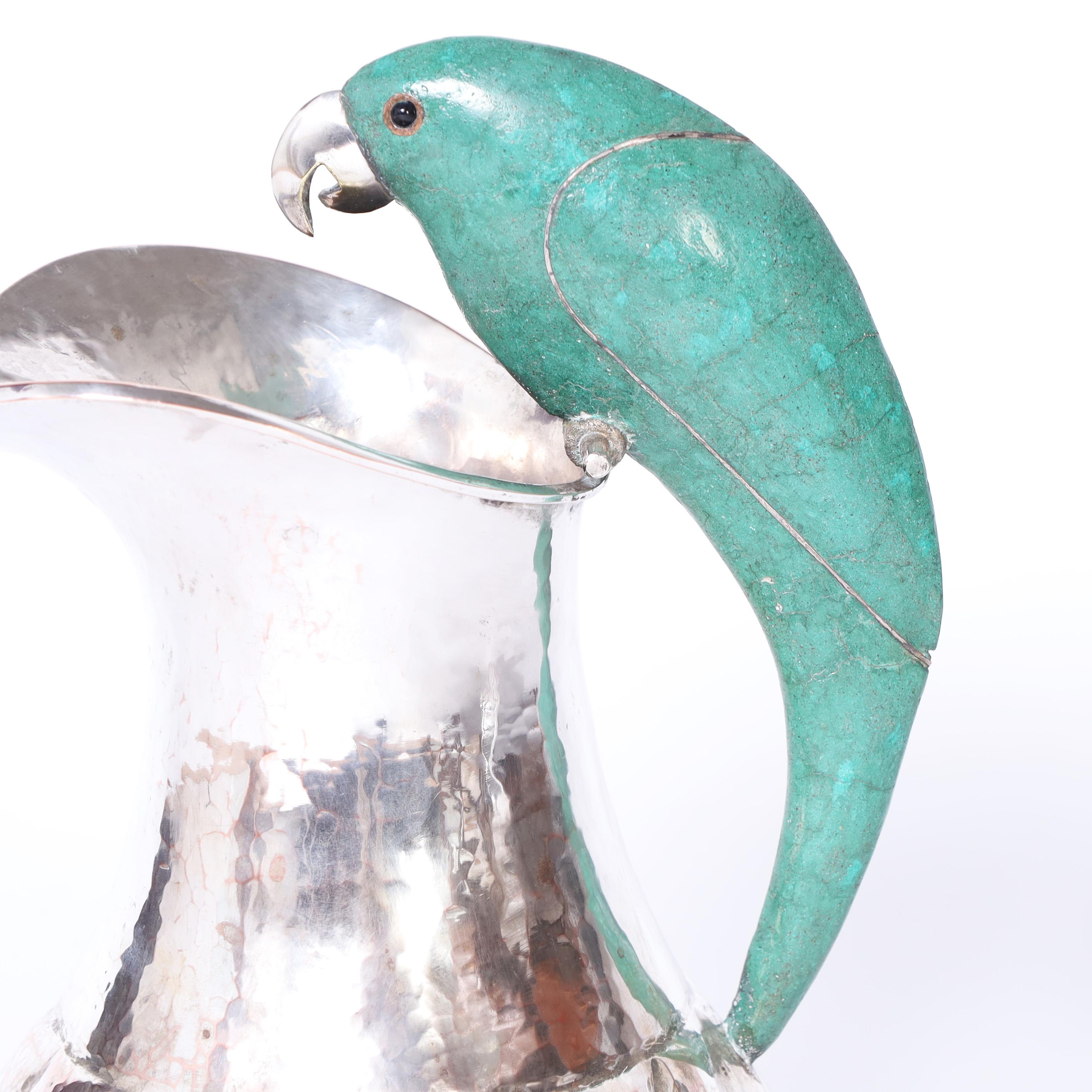 20th Century Los Castillo Style Near Pair of Mid Century Silver Plate Pitchers with Parrots For Sale