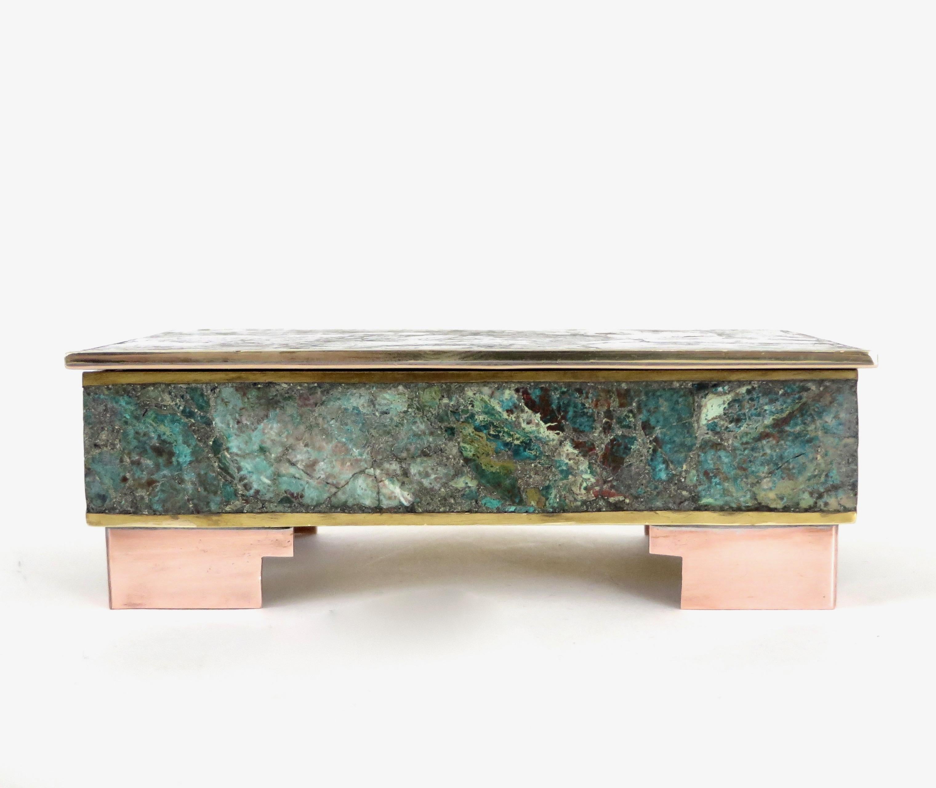 Hinged inlaid malachite and sodalite brass, copper and bronze metal box with rosewood interior,
circa 1960
Stone inlay, bronze, brass on raised copper feet.
Marked Hecho en Mexico.