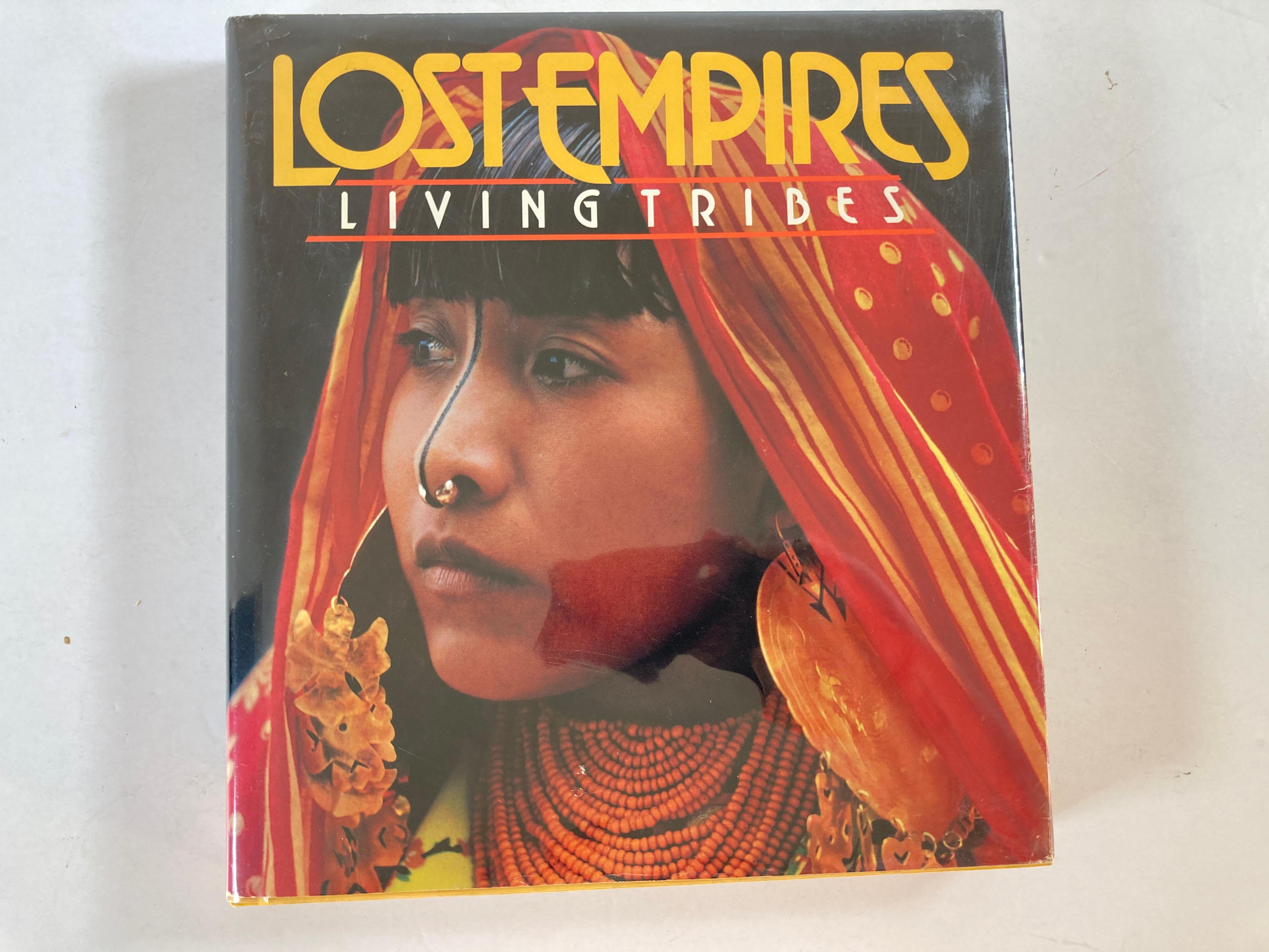 Lost Empires: Living Tribes by Ross S. Bennett
Hardcover, 402 pages
Published November 1st 1982 by National Geographic Society.
Hardcover; Washington, D.c.:
This is a beautiful large coffee table Art and Photography book.
Title
LOST EMPIRES,