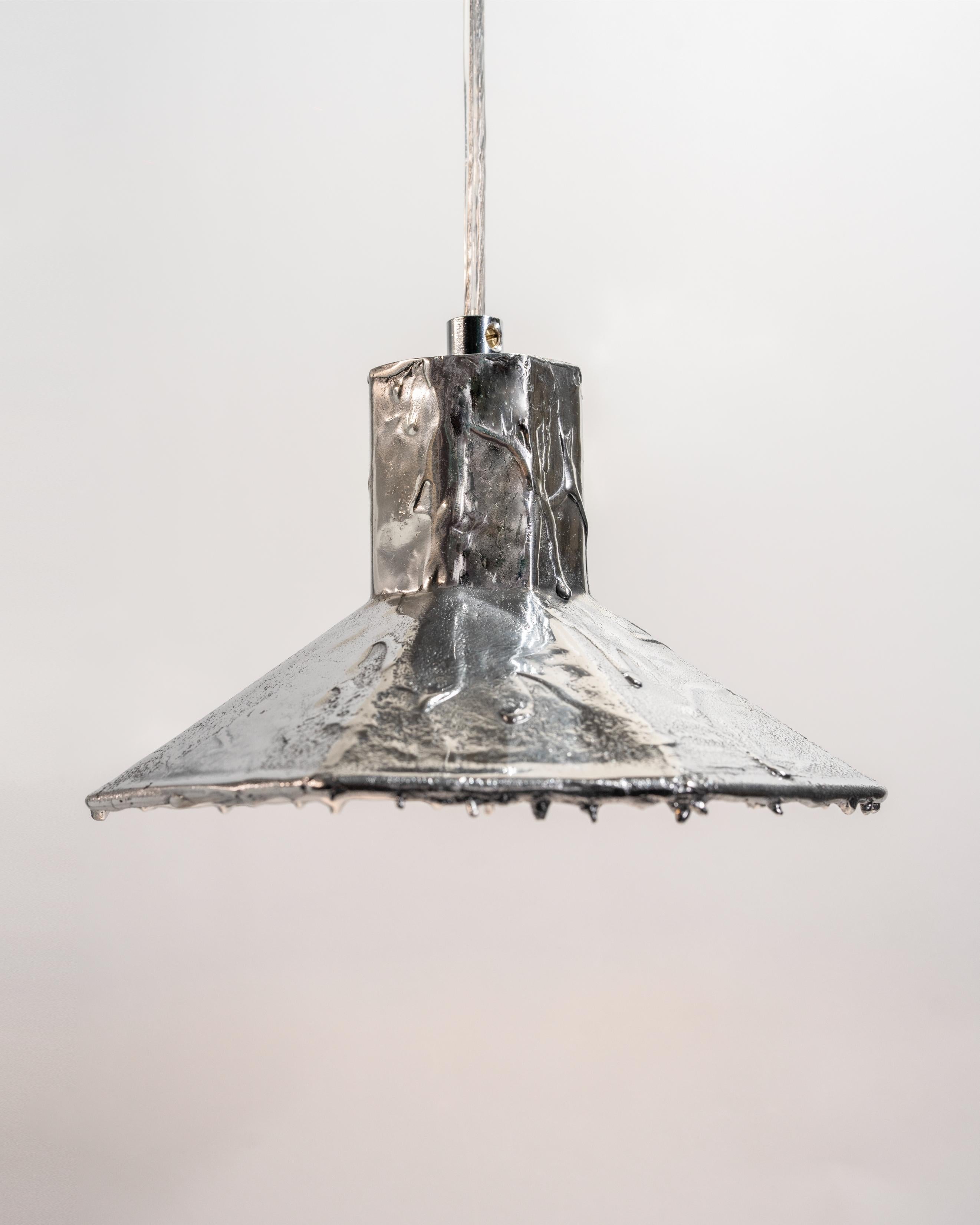 Lost Pendant 8 Lamp by Studio Birtane
PHILIA Exclusive.
Dimensions:  W 22 x D 22 x H 12 cm
Materials: Cast Aluminium
Cast Bronze version and Polished or Patinated finishes are also available.

All our lamps can be wired according to each country. If
