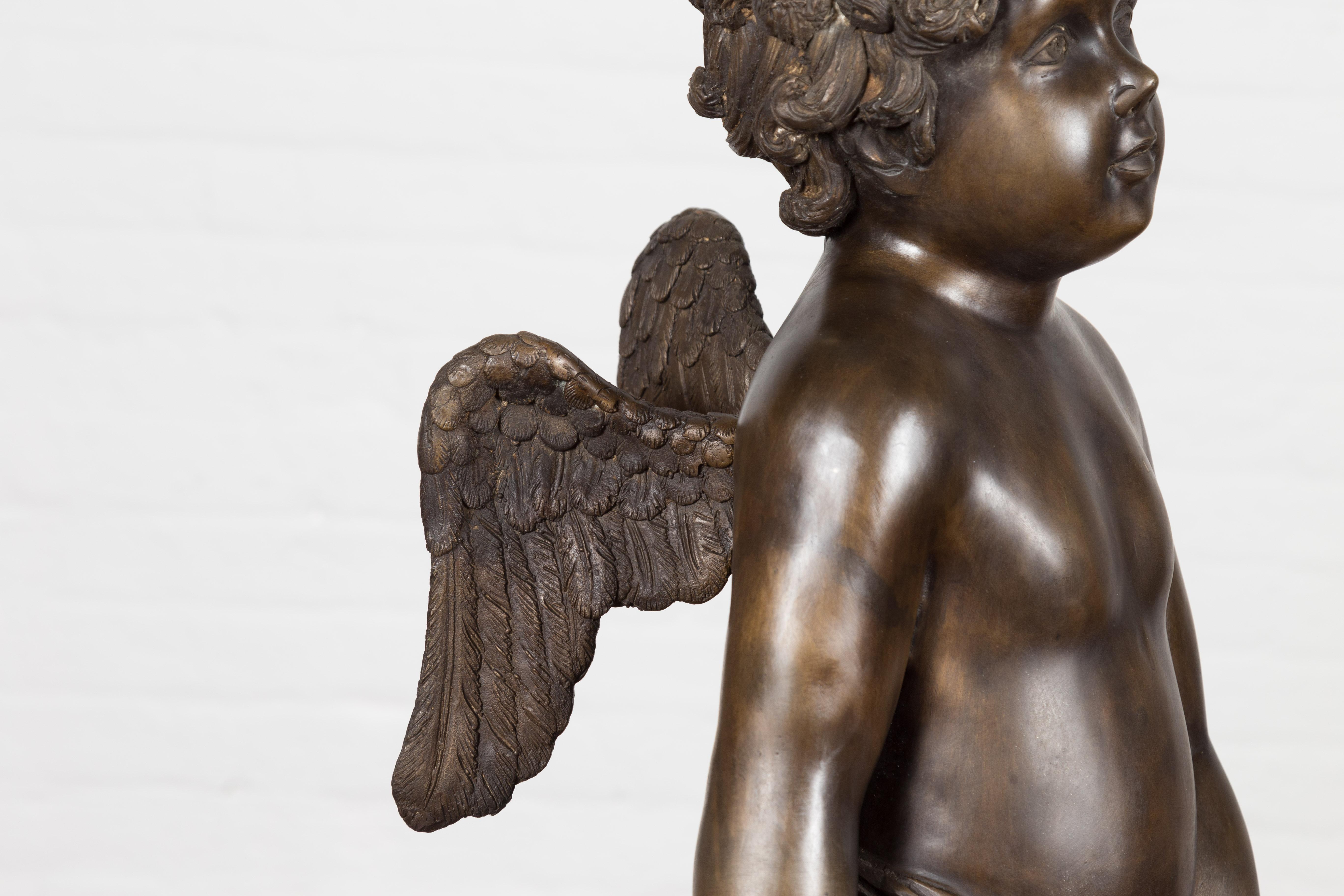 Lost Wax Bronze Statue of a Winged Cherub Standing on a Shell in Dark Patina For Sale 5