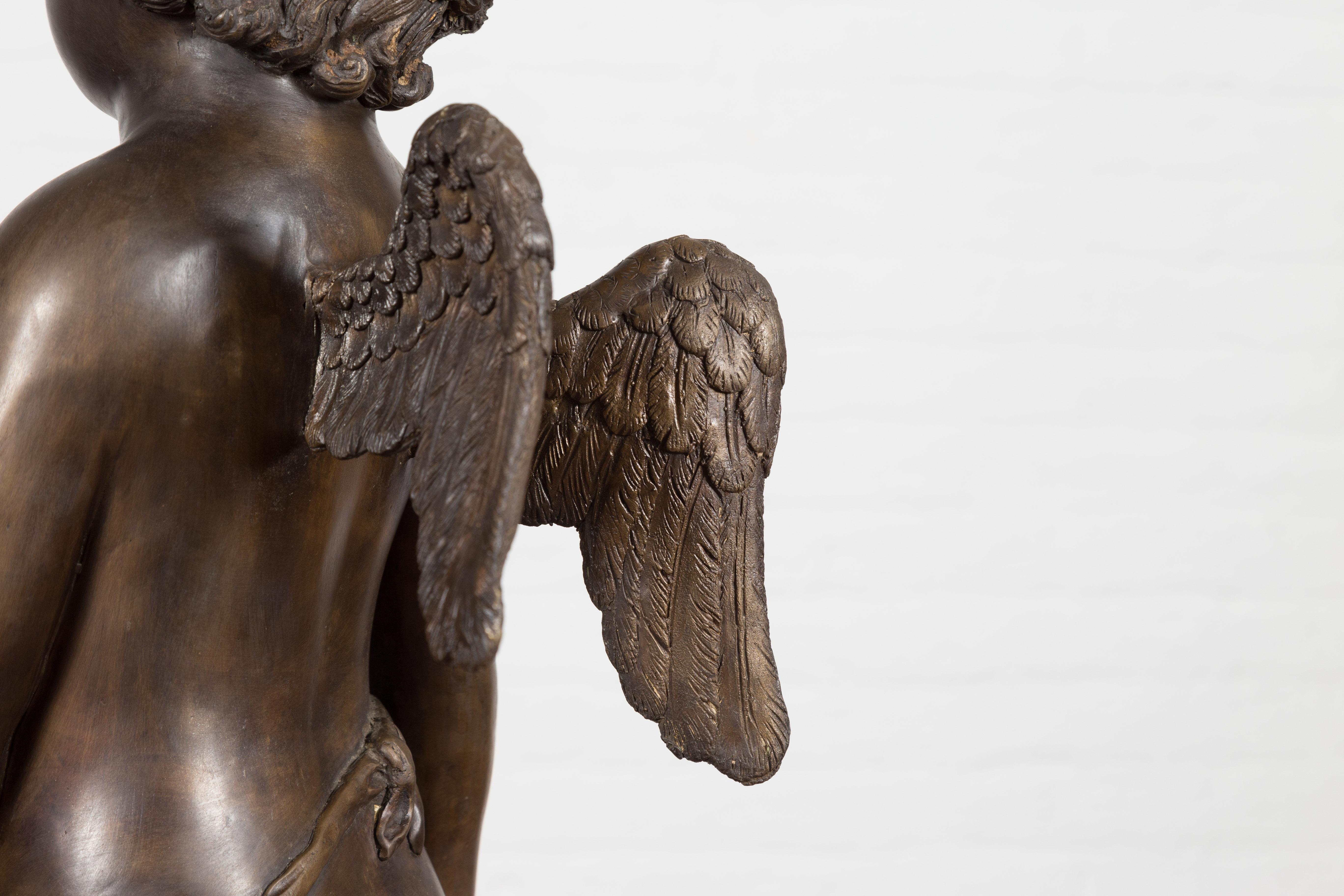 Lost Wax Bronze Statue of a Winged Cherub Standing on a Shell in Dark Patina For Sale 10