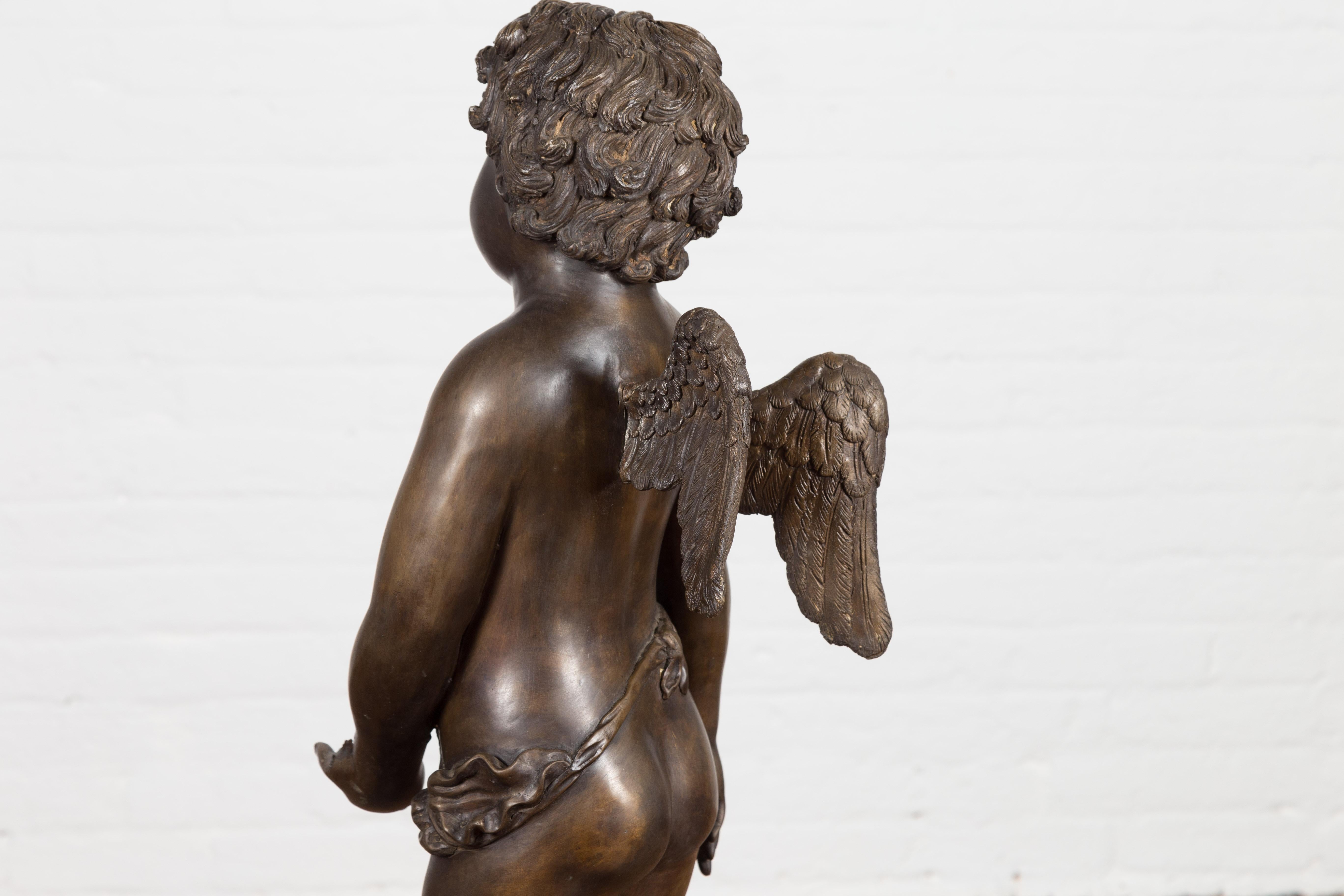 Lost Wax Bronze Statue of a Winged Cherub Standing on a Shell in Dark Patina For Sale 12