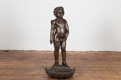 Lost Wax Bronze Statue of a Winged Cherub Standing on a Shell in Dark Patina