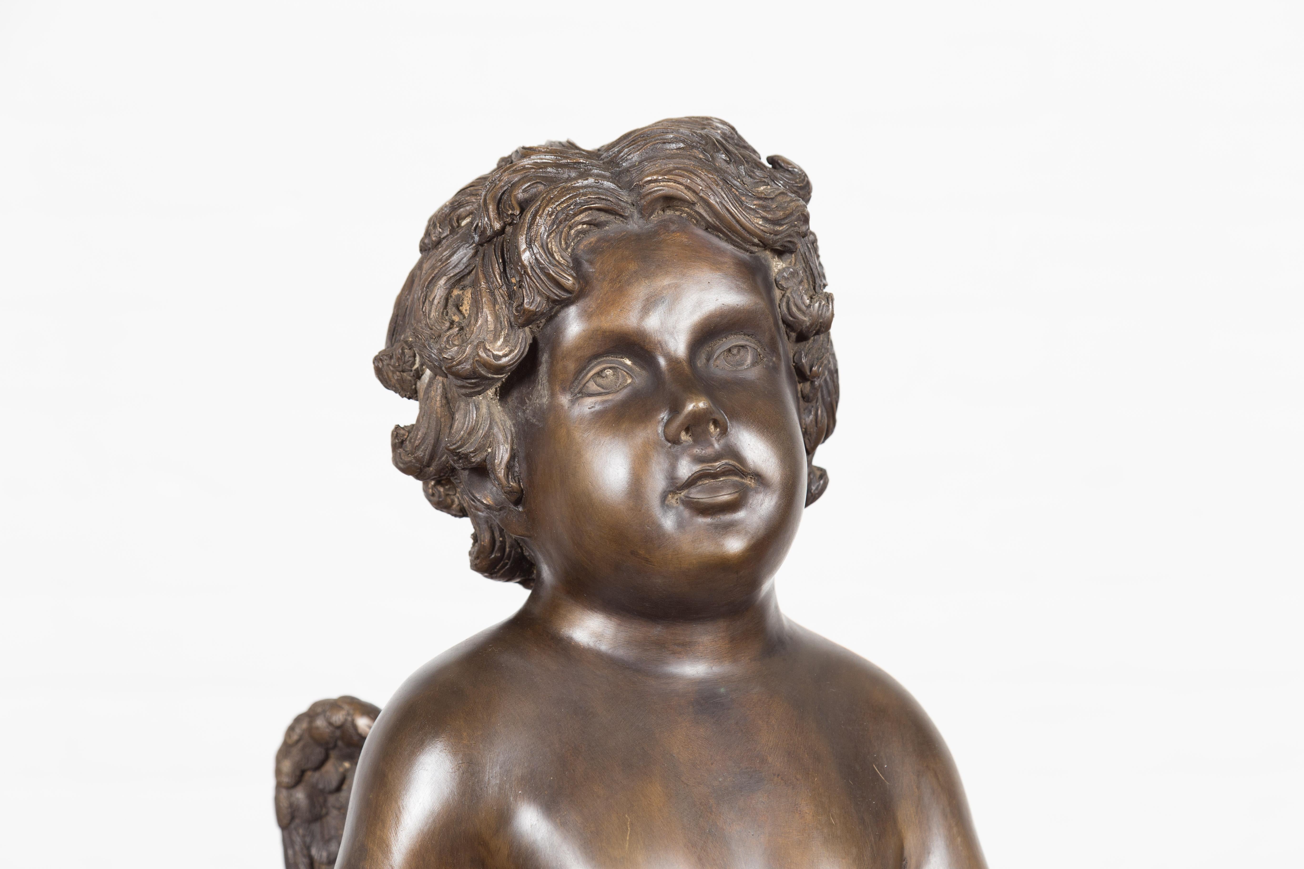 Lost Wax Bronze Statue of a Winged Cherub Standing on a Shell in Dark Patina In Good Condition For Sale In Yonkers, NY