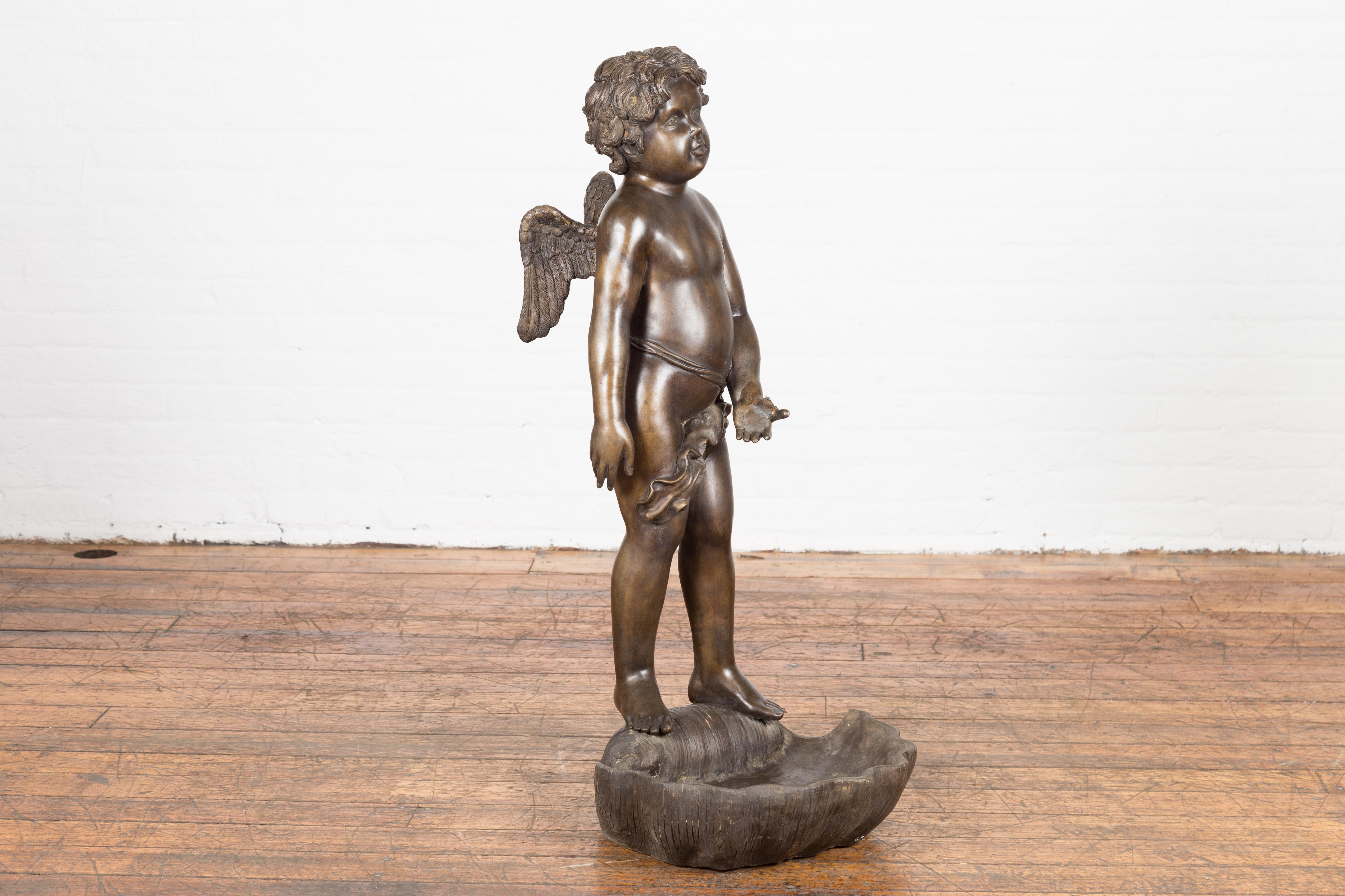 Lost Wax Bronze Statue of a Winged Cherub Standing on a Shell in Dark Patina For Sale 1