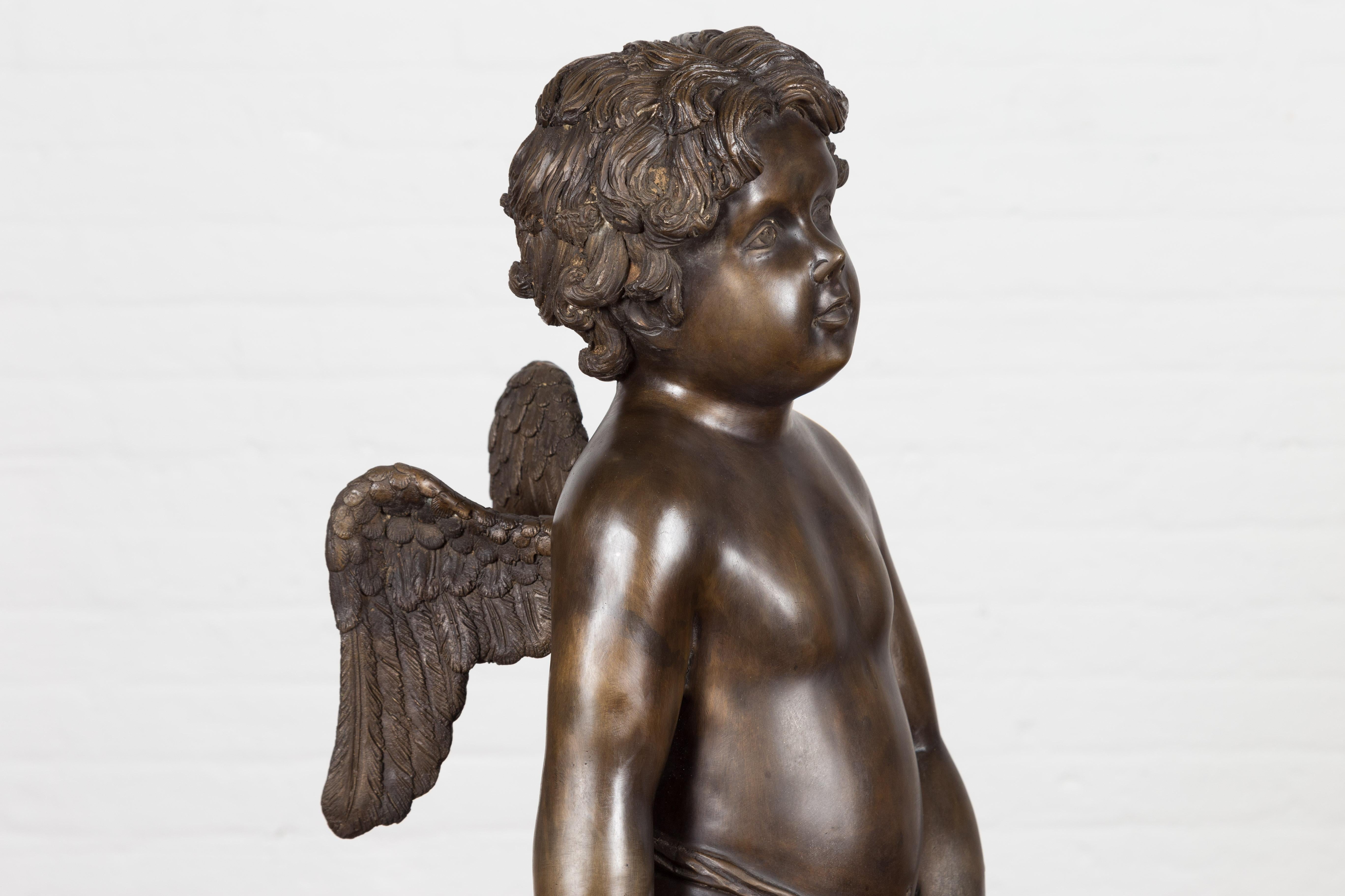 Lost Wax Bronze Statue of a Winged Cherub Standing on a Shell in Dark Patina For Sale 3
