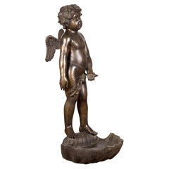 Lost Wax Bronze Statue of a Winged Cherub Standing on a Shell in Dark Patina