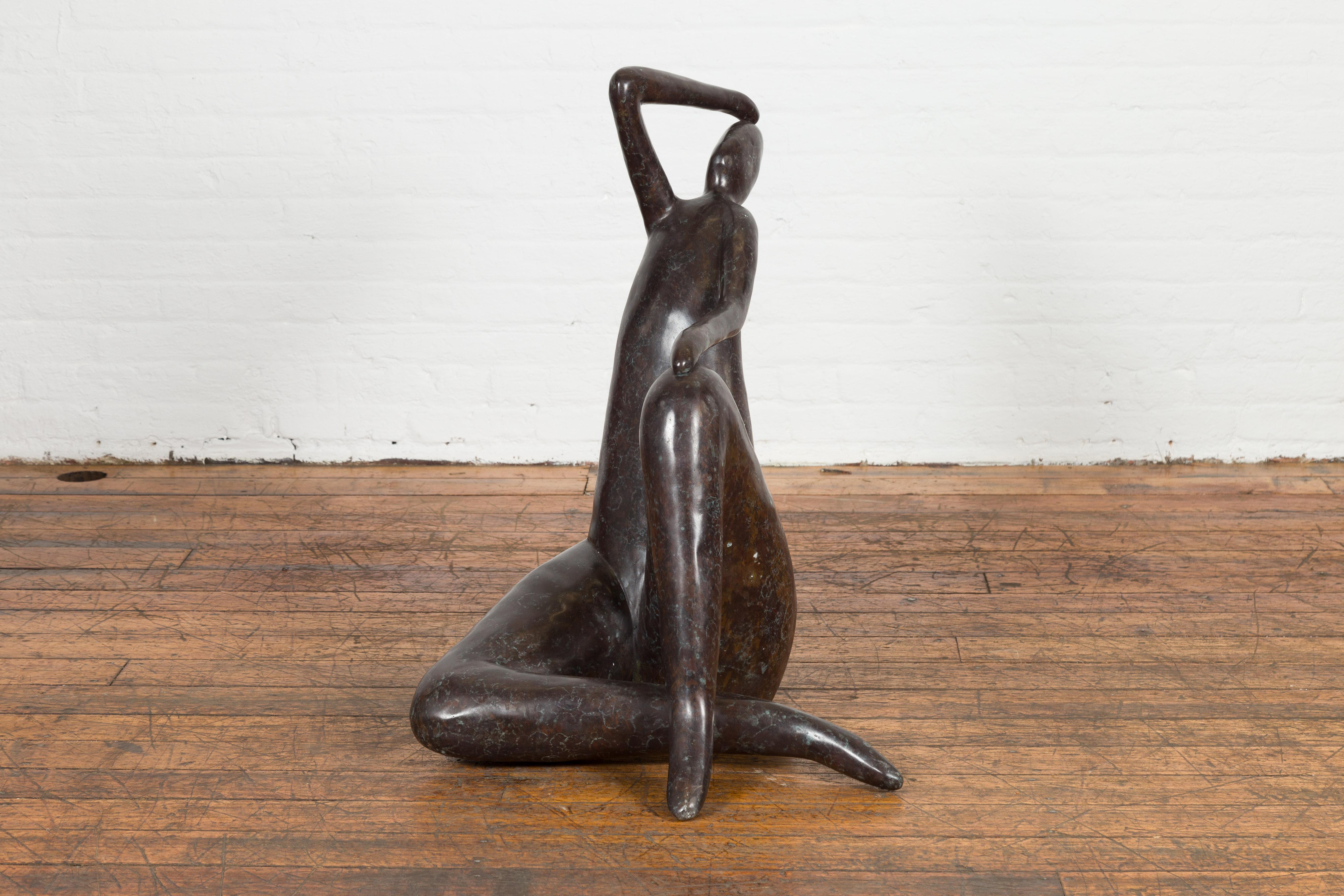 Lost wax cast bronze abstract sculpture depicting a lady in dark patina. Inject artistic flair into your environment with this contemporary bronze sculpture of an abstract lady. Crafted using the ancient lost wax casting method, this statue exudes
