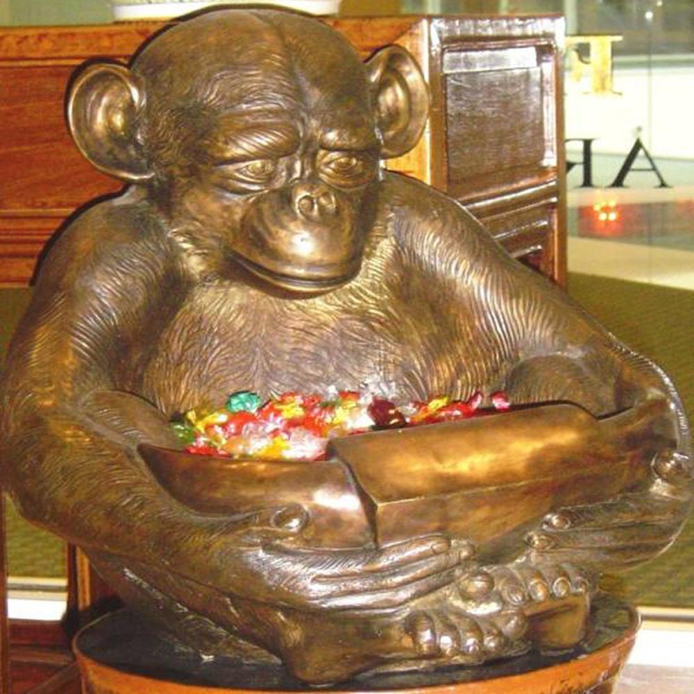 monkey holding bowl
