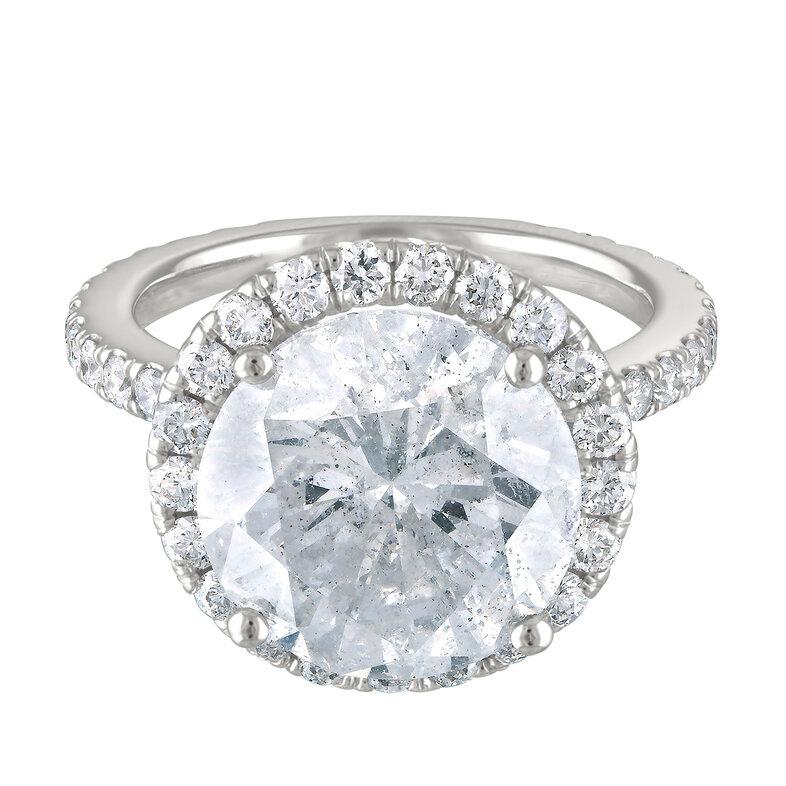 Gia Certified Round 6.62 cts Centerstone Diamond (has Laser drill) set in Halo  Ring (1.15 cts sidestones).
Ring options: 
You can choose your own Ring size (must be set before shipping item only).
Return Policy: 3 days from delivery
Buyer pays for