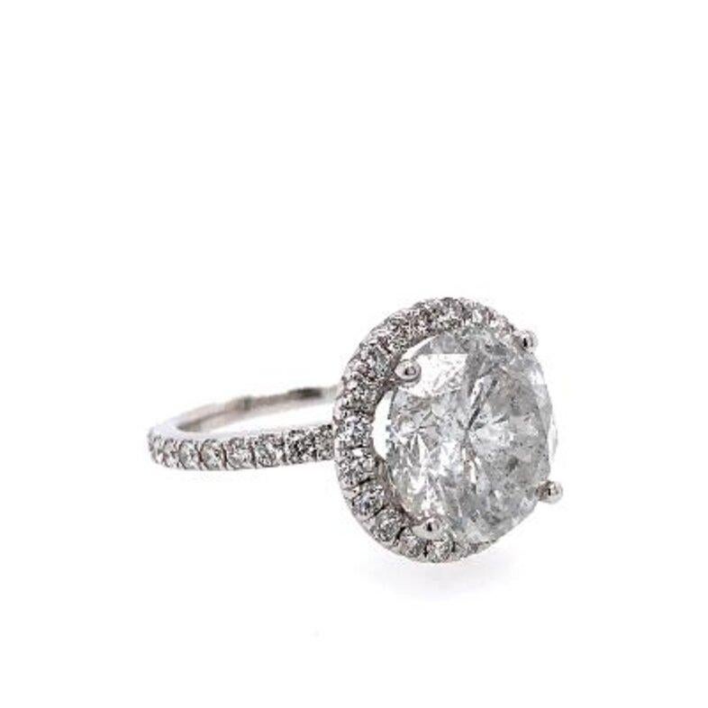 Round Cut Lot: 7754 GIA Certified Round 6.62cts Ii3 Diamond Set in 18k Halo Ring For Sale