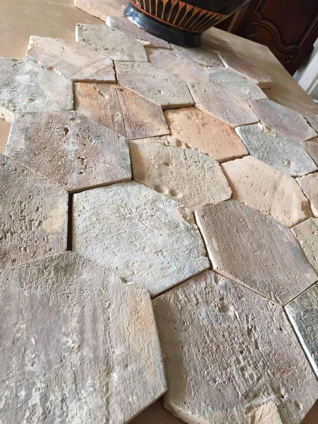 For a warm, rustic, Mediterranean look indoors or outdoors, look no further than our antique terracotta tiles. Crafted in France circa 1750, these Classic tiles are each a hexagon shape. The ceramic flooring has a geometric pattern and a discrete
