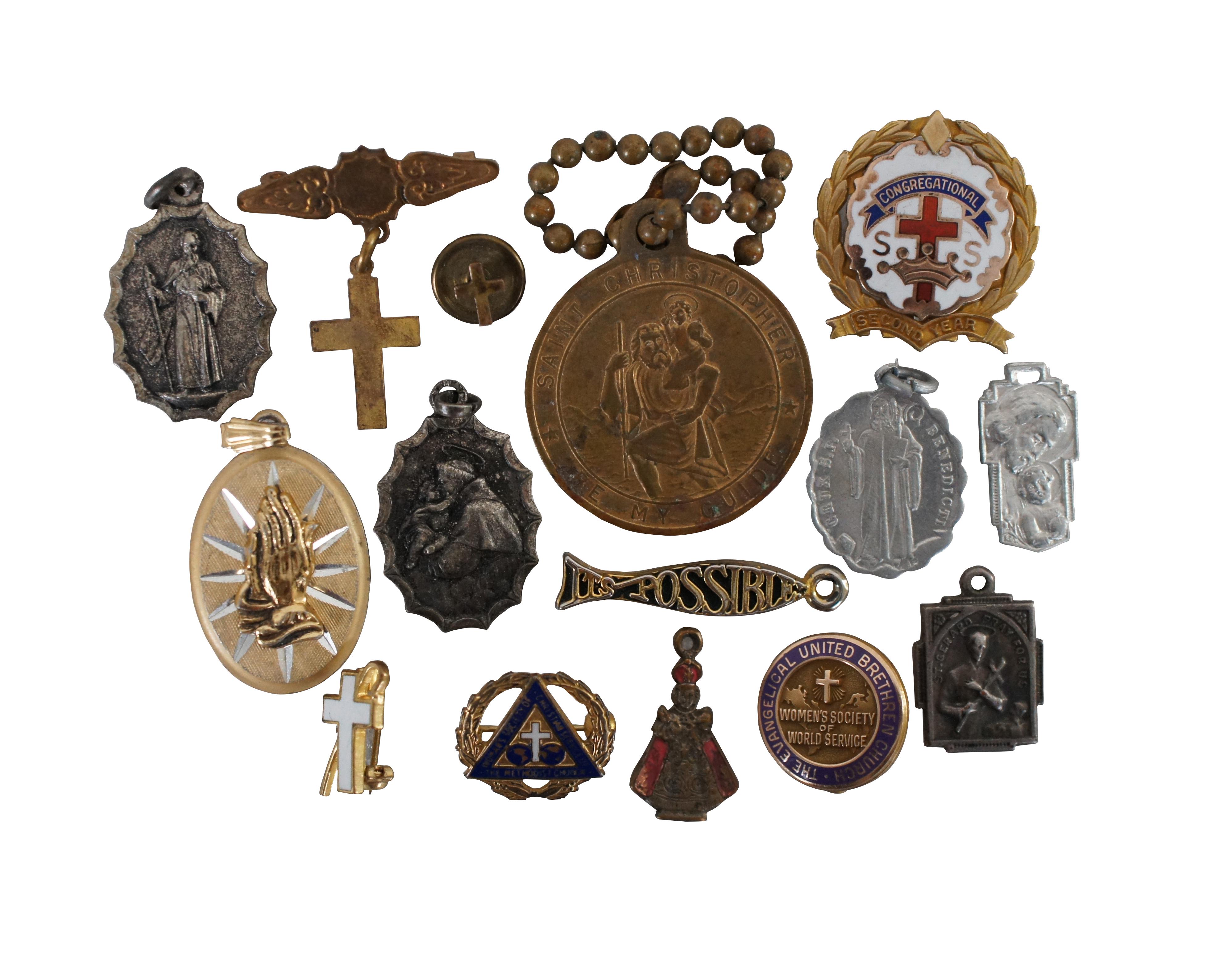 Assorted lot of 29 vintage and antique Christian / Catholic saint medals – including St Benedict, St Christopher, St Joseph, St Anthony, St Jude, The Infant of Prague, St Gerard, and several manifestations of the Virgin Mary / Miraculous Medals -
