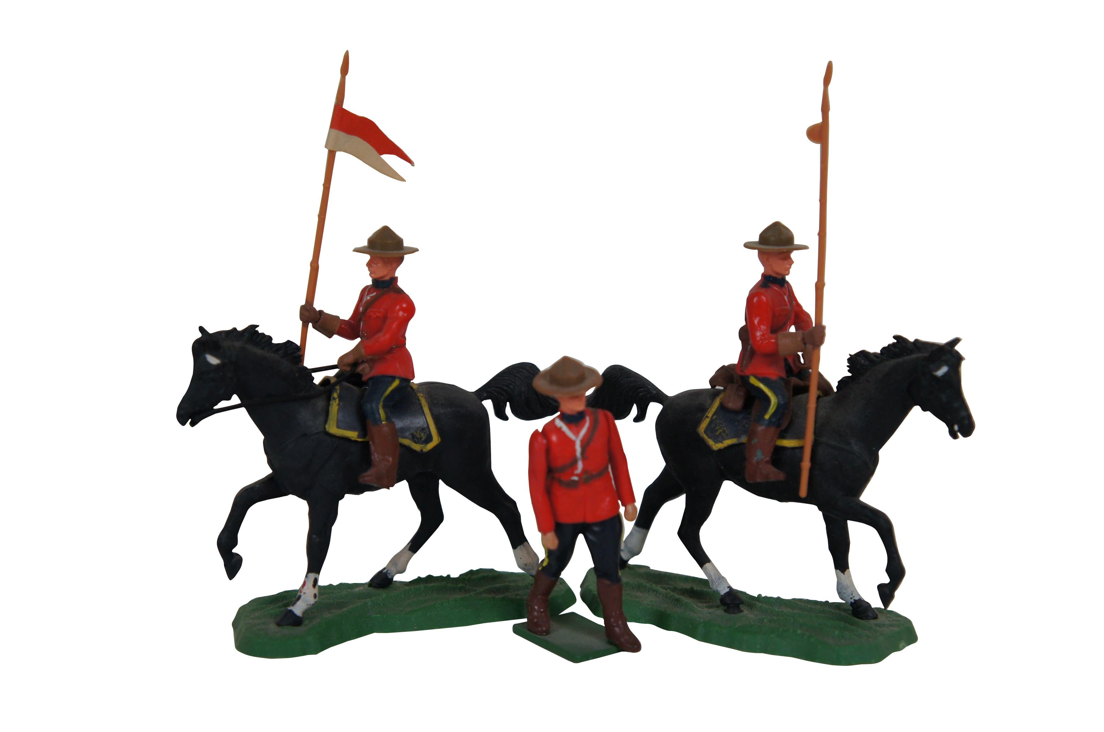 Lot of 61 circa 1960s - 1970s Deetail plastic toy soldiers by Britain Ltd. Lot includes Royal Canadian Mounties (two on horseback), Scots Guards, Scottish Highlanders including pipes and drums (one on horseback), and seven guardhouses.

