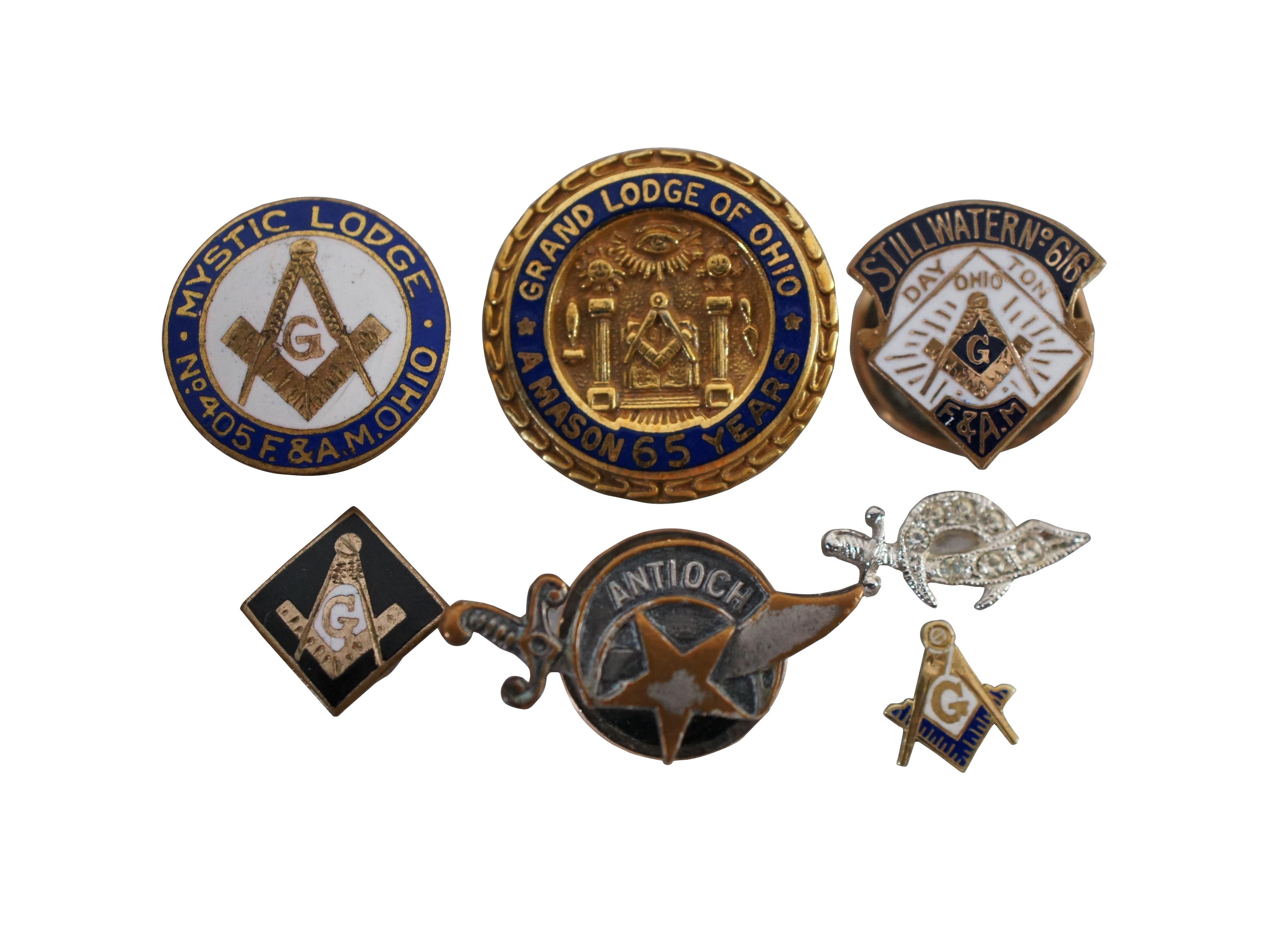 Lot of 7 vintage enameled Masonic / Shriner lapel pins, four square & compass / scimitar and moon, and three representing specific Ohio lodges. One is 14k gold, and one has diamonds.

Largest - 0.75” x 0.75” (Length x Width).