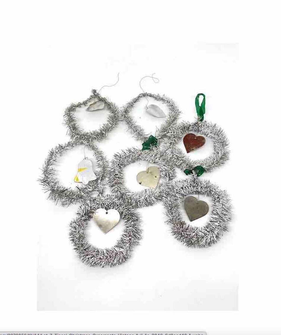 A rare collection of 7 feather tree tinsel ornaments. These ornaments, were made from tinsel and wire, would be a great antique addition for your Christmas, feather tree or sitting on a decorative branch in your bathroom or hall way.
 