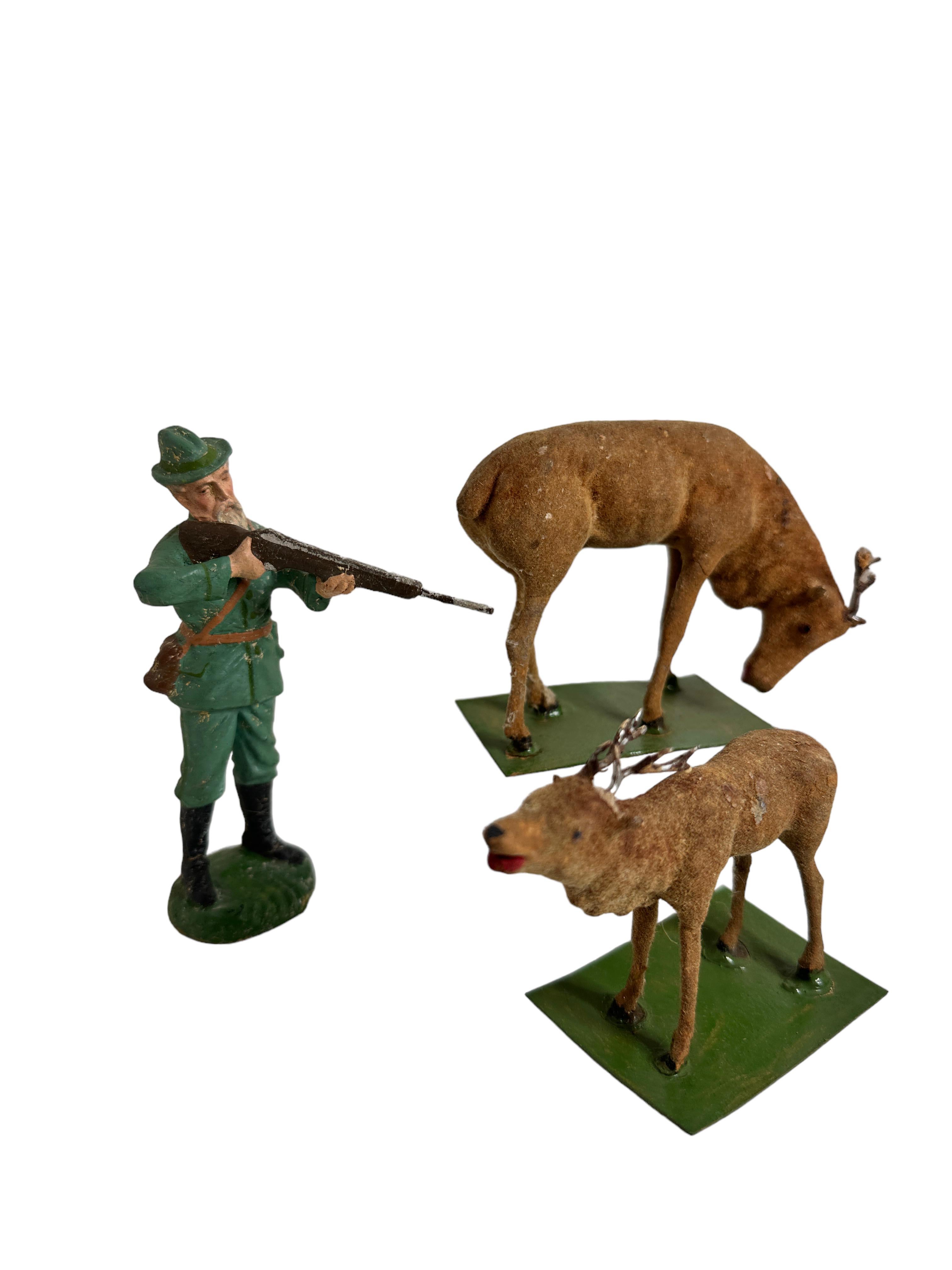 Antique German set of five Putz stick-legged Deers and a Hunter. All of them are genuine antique German Christmas nativity scene figures. As they are all old, most show the expected signs of age and use. This is a fabulous set of stick-legged deers