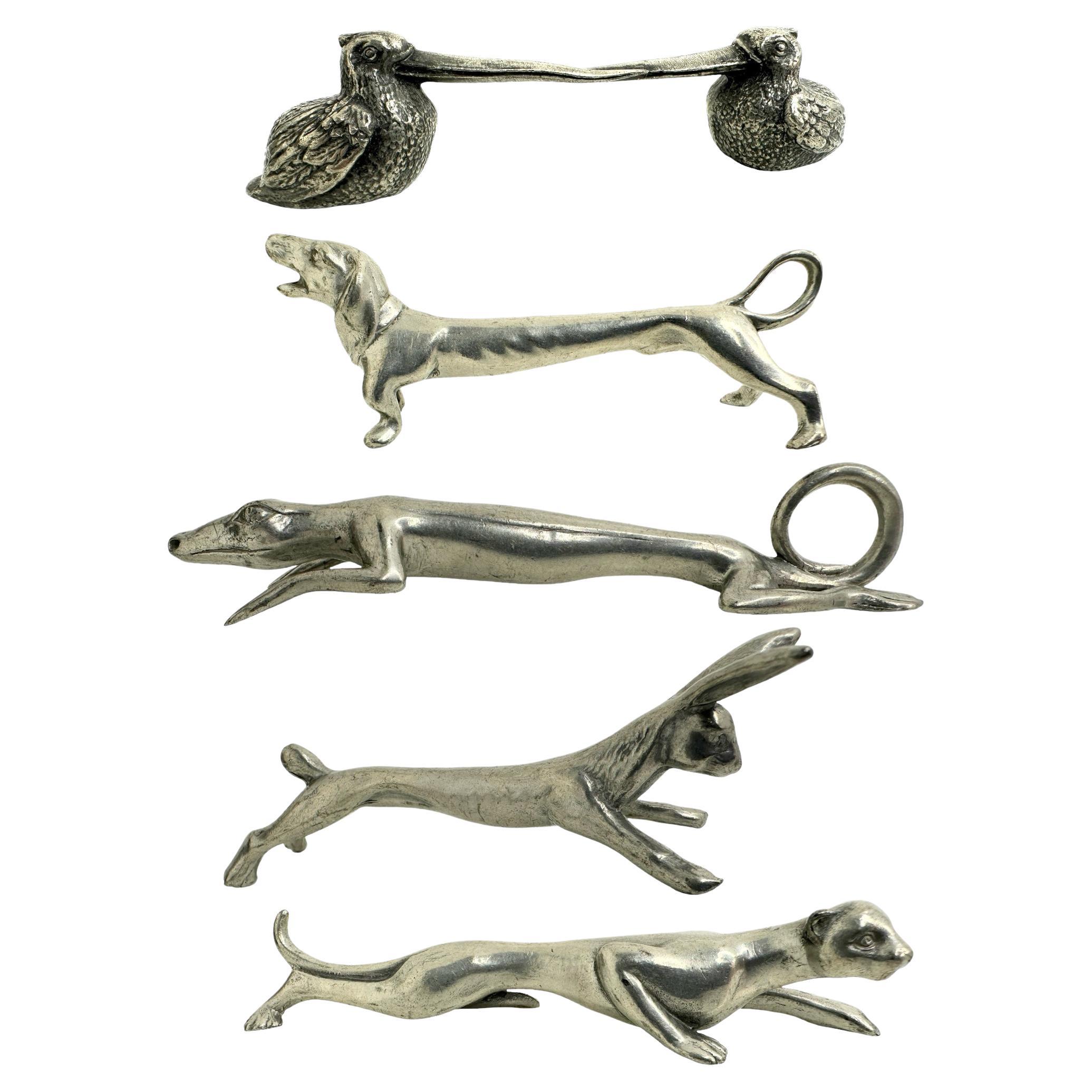 Lote de cinco apoyacuchillos de metal plateado con motivos de animales Austria Siglo XX