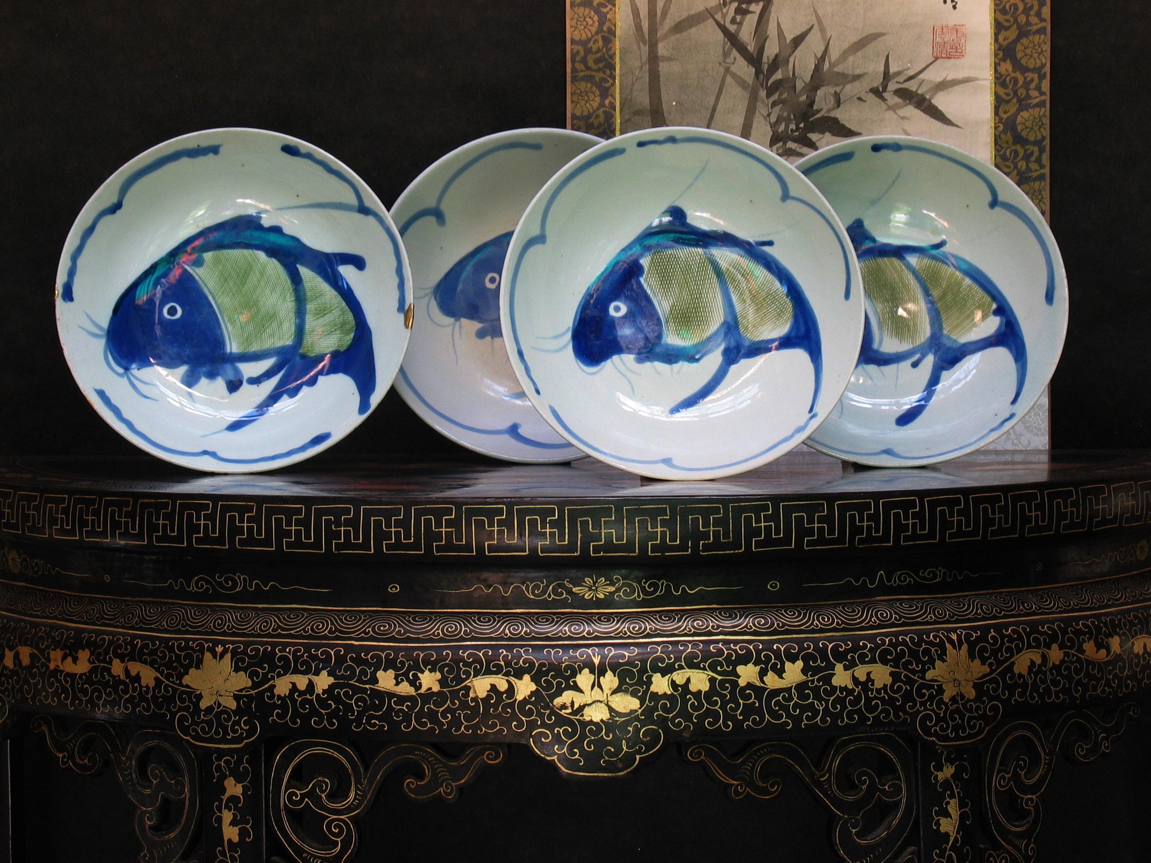 A lot of four Chinese handpainted
Porcelain bowls

late Qing dynasty.

Each painted in loose style with a leaping carp
with green colored cross-hatched scales
all approx. 9 in.(23 cm.)

One has approximately 2 in. hairline crack
and