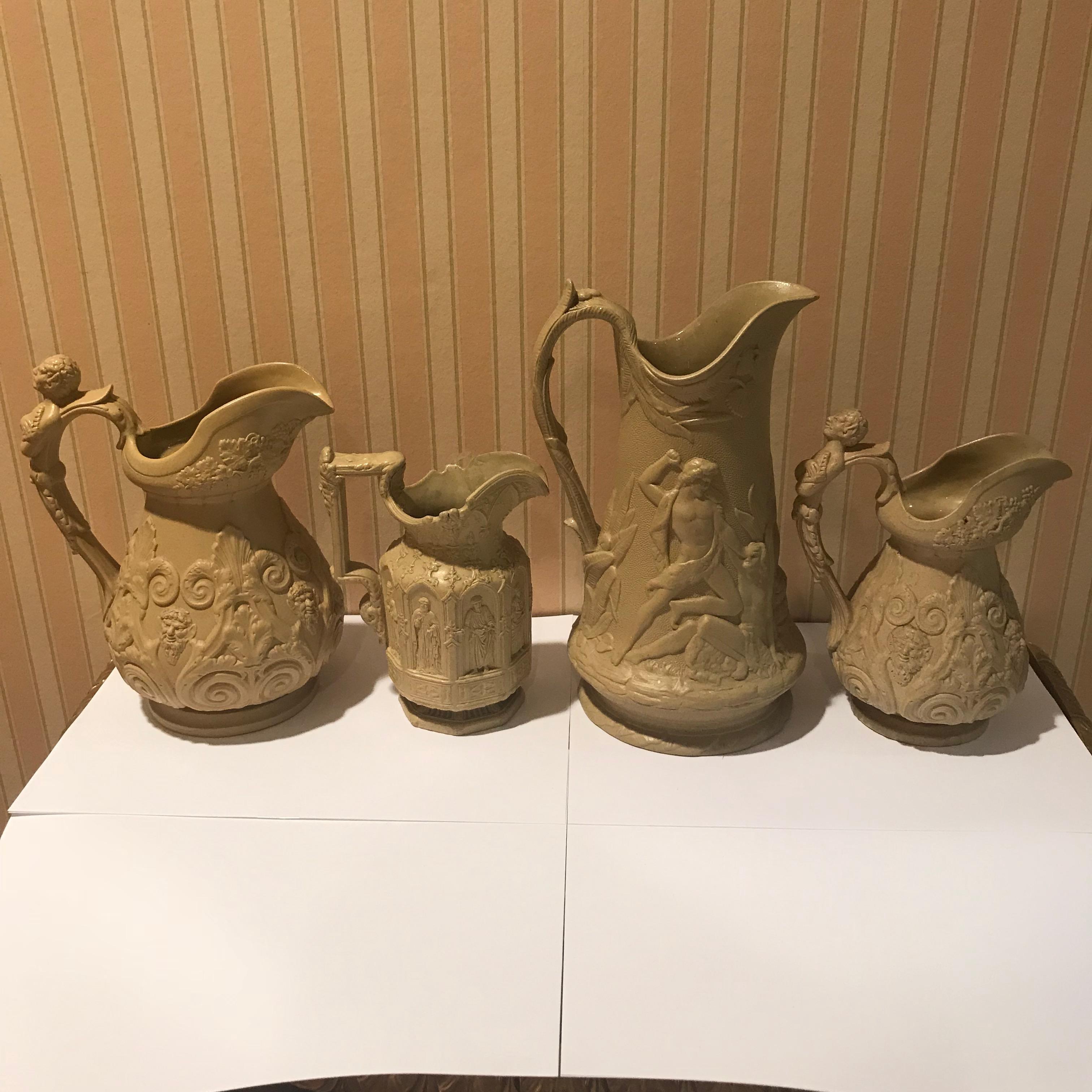 European Lot of Four Mid-19th Century Relief Pitchers For Sale