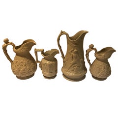 Lot of Four Mid-19th Century Relief Pitchers