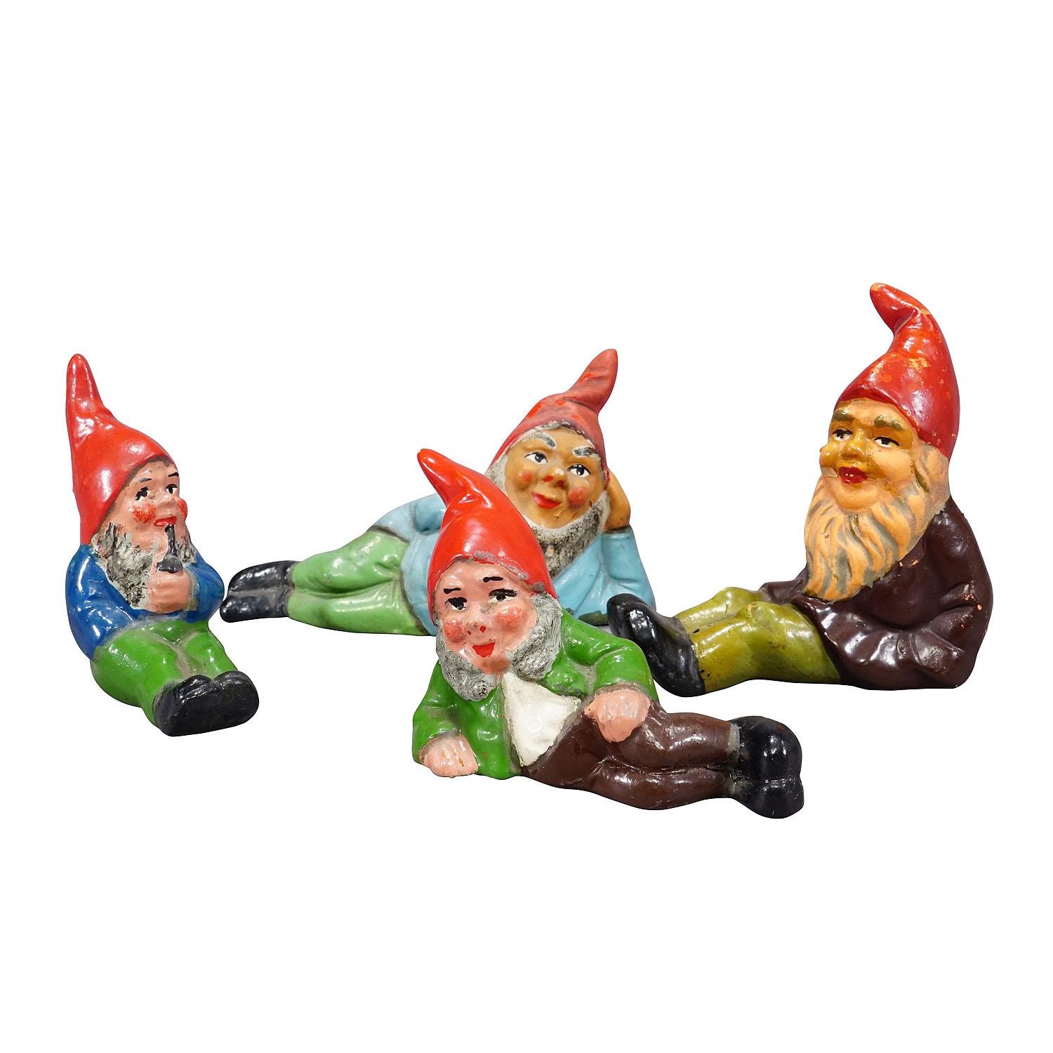 Lot of Four Vintage Terracotta Garden Gnomes, Germany ca. 1950s
Item e7221
A whimsy set of four tiny garden gnomes made in Germany ca. 1950s probably by Heissner. They are made of terracotta and hand-painted with bright colors. Good used vintage