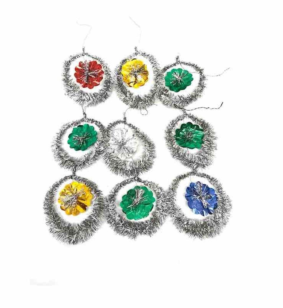A rare collection of 9 feather tree tinsel ornaments. These ornaments, were made from tinsel and wire, would be a great antique addition for your Christmas, feather tree or sitting on a decorative branch in your bathroom or hall way.
  