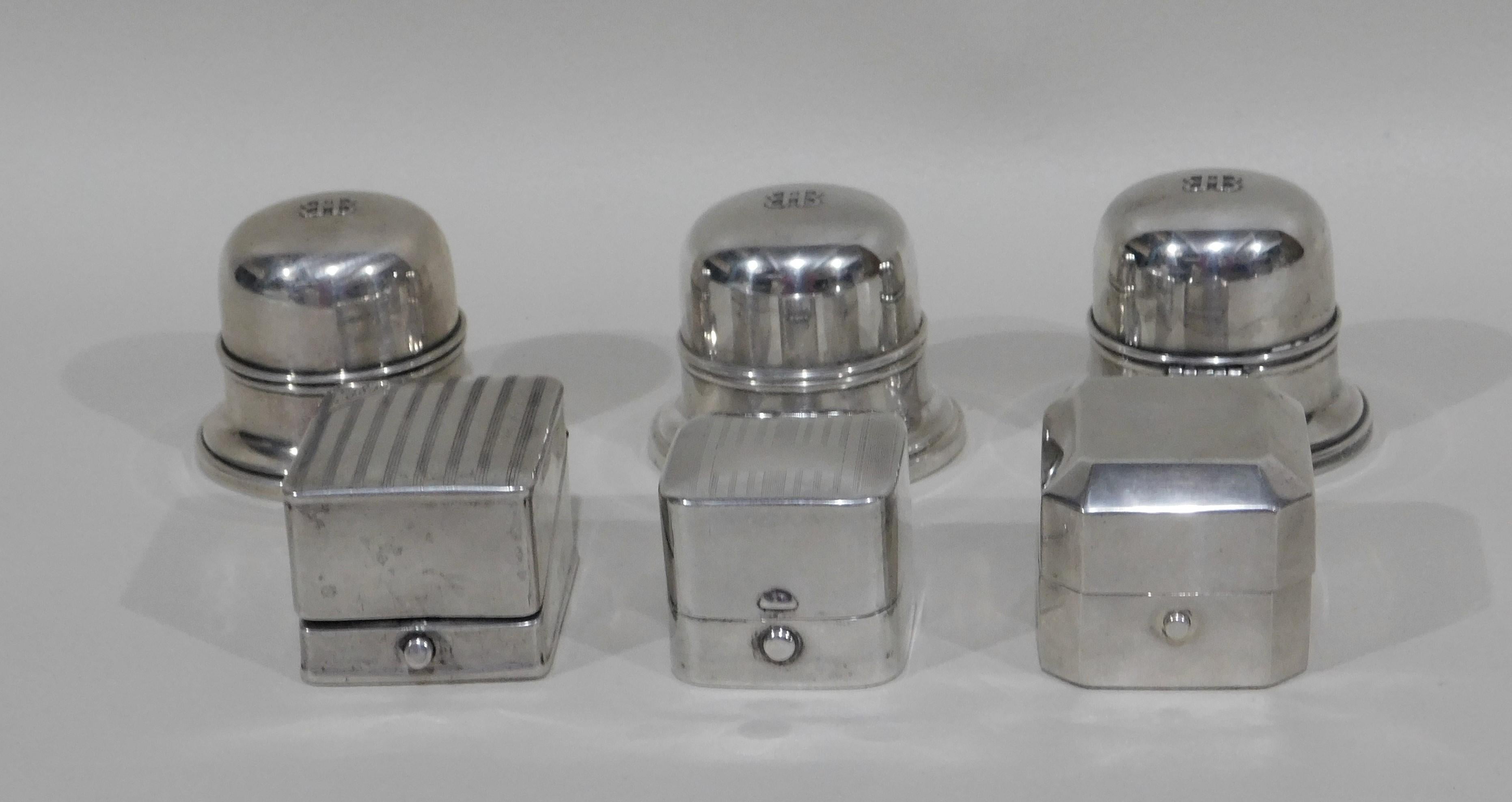 Six sterling silver ring boxes, circa 1920 to 1930s. Three round Birks Toronto Canada measure 2 inches wide x 1.75 inches high and one square box is Birks measuring 1.75 x 1.75 x 1.25 inches high. Two other square boxes are stamped from England.