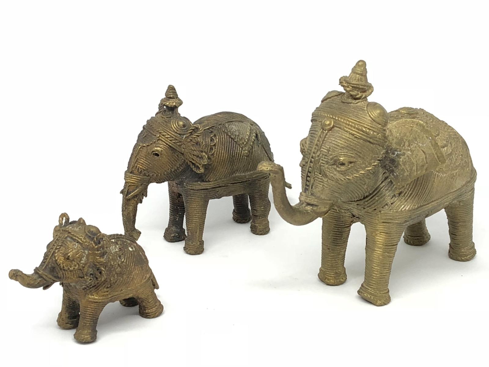 A decorative lot of three handmade elephant sculptures or statues. Some wear but this is old-age. Made of brass. We think it is from Asia and was made in the mid-20th century. Measures: Tallest is approximate 4 1/2