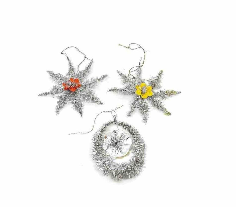 A rare collection of three feather tree tinsel ornaments. These ornaments, were made from tinsel and wire, would be a great antique addition for your Christmas, feather tree or sitting on a decorative branch in your bathroom or hall way.
 