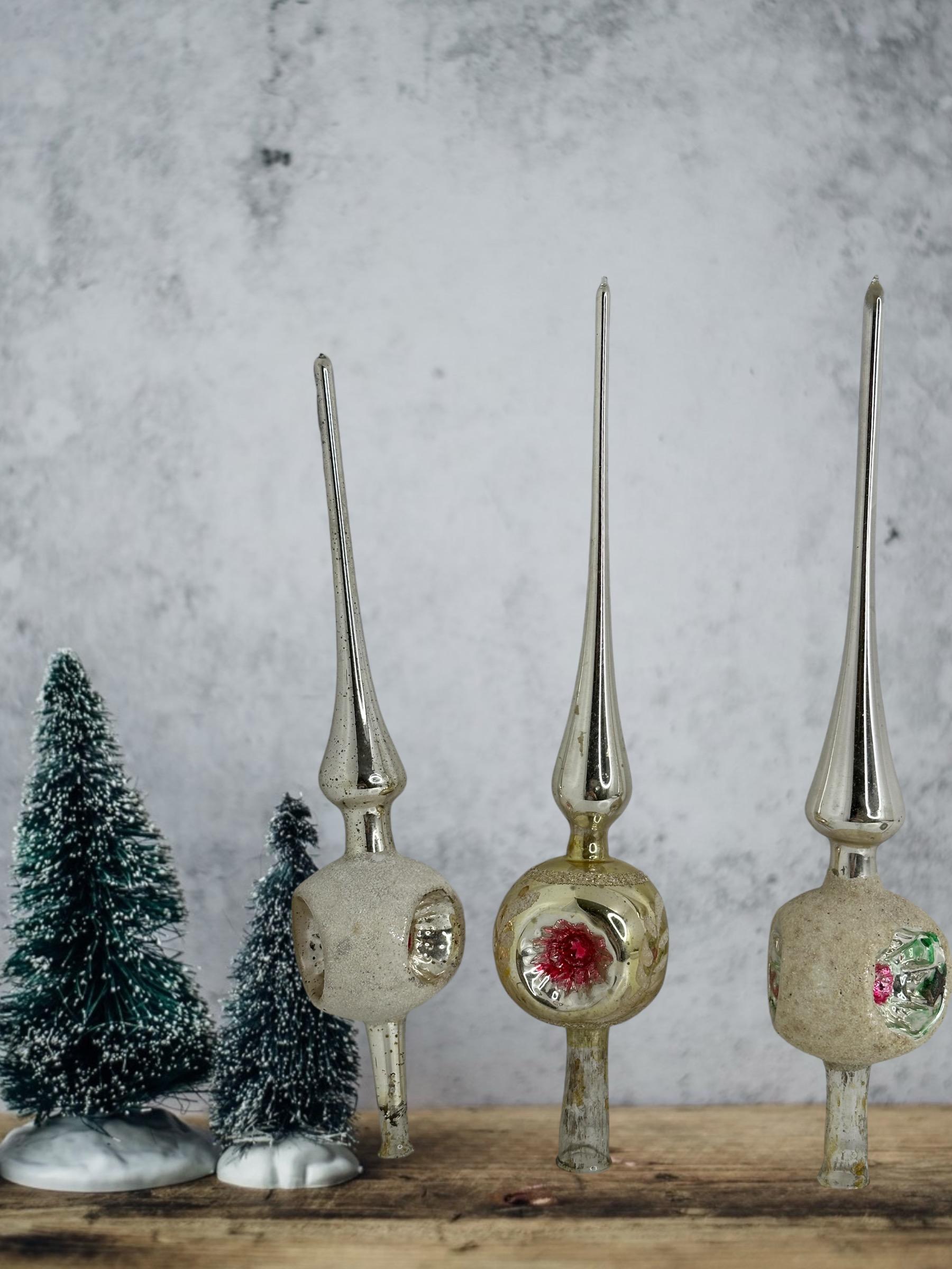 A rare set of three feather tree glass Christmas tree topper from Germany. Each is made from mouth blown glass, would be a great antique addition for your Christmas or feather tree. Should also look great in your entry hall at a console table,