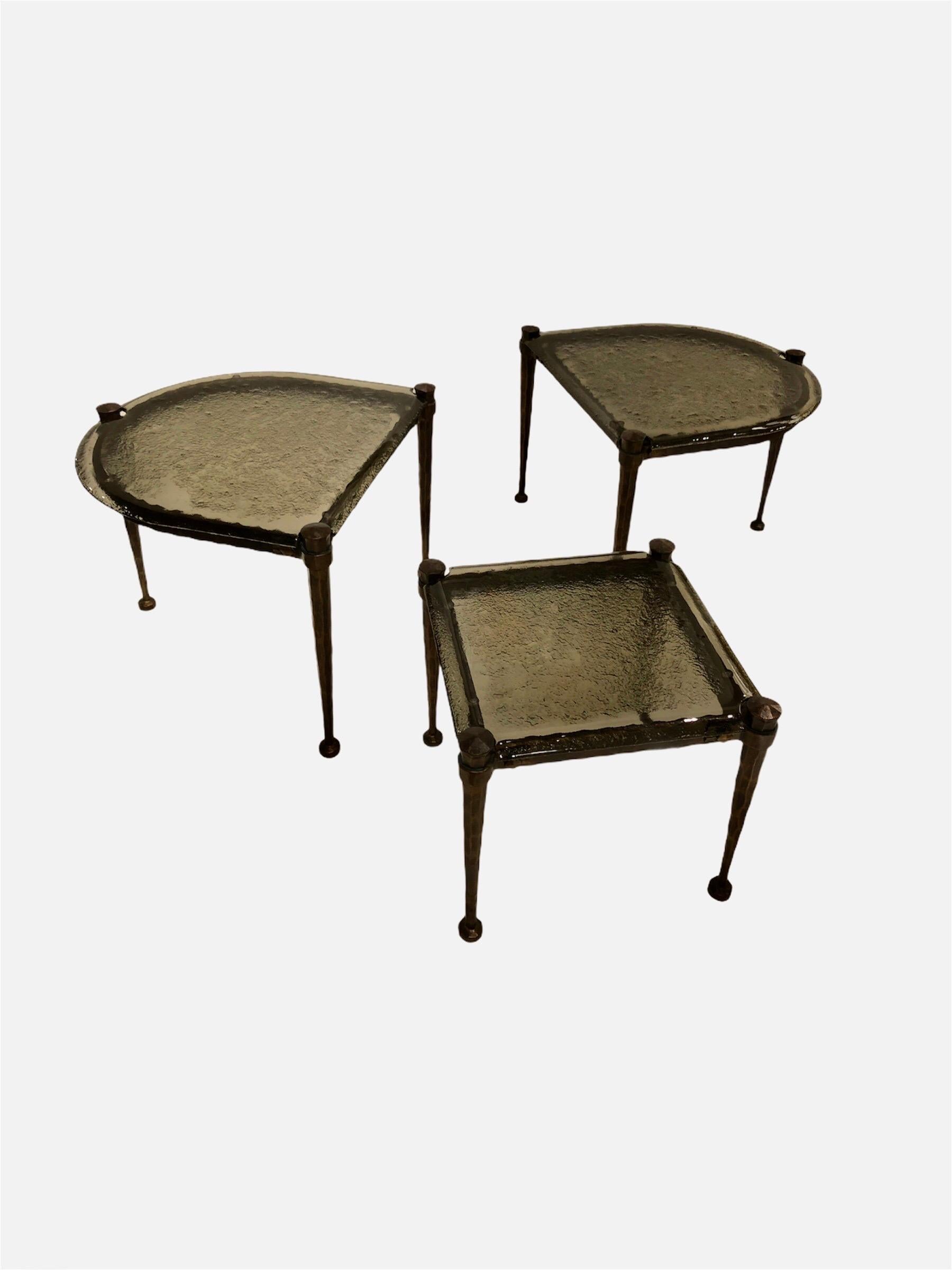 Solid bronze coffee table in 3 parts and smoked glass top.
The 3 pieces can make a very nice and original coffee table or side table
Designed and manufactured (handmade) by Lothar Klute
Germany, early 1970s. signed on the leg. 
Dimensions: 70 x