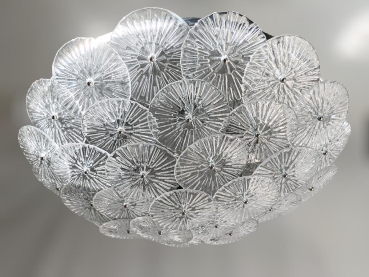Italian flush mount with layered textured clear Murano glass discs mounted on chrome finish metal frame, designed by Fabio Bergomi for Fabio Ltd / Made in Italy
6 lights / E26 or E27 type / max 60W each
Measures: Diameter 29.5 inches, height 7