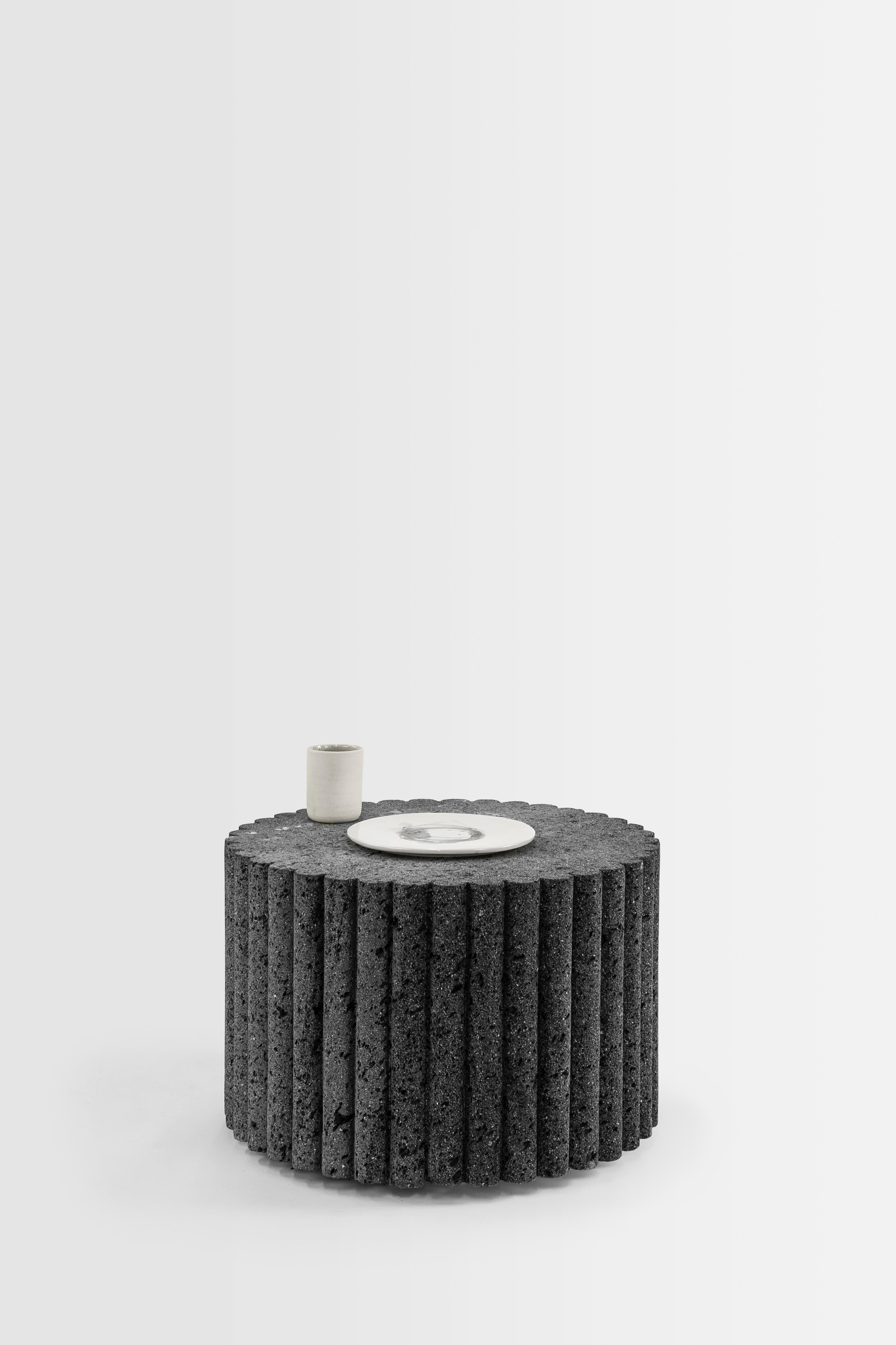 LOTO ROCA coffee table is exploration personified. This volcanic stone monolith has been carved mastering a meditative process with chisel and hammer. A coffee table recalling the esthetic character of the LOTO ROCA family: a meeting point in social